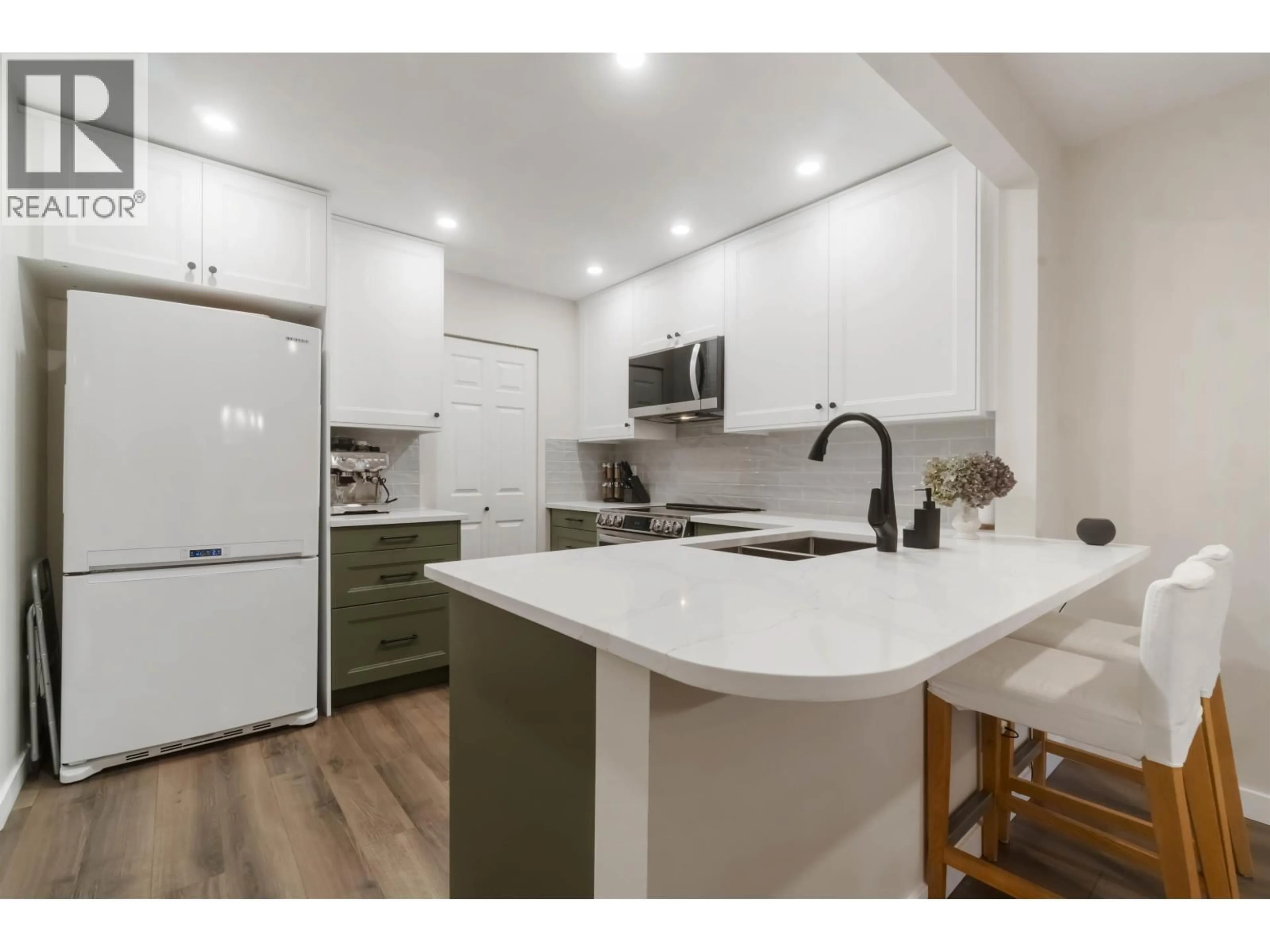 Open concept kitchen, unknown for 310 - 1000 BOWRON COURT, North Vancouver British Columbia V7H2V8