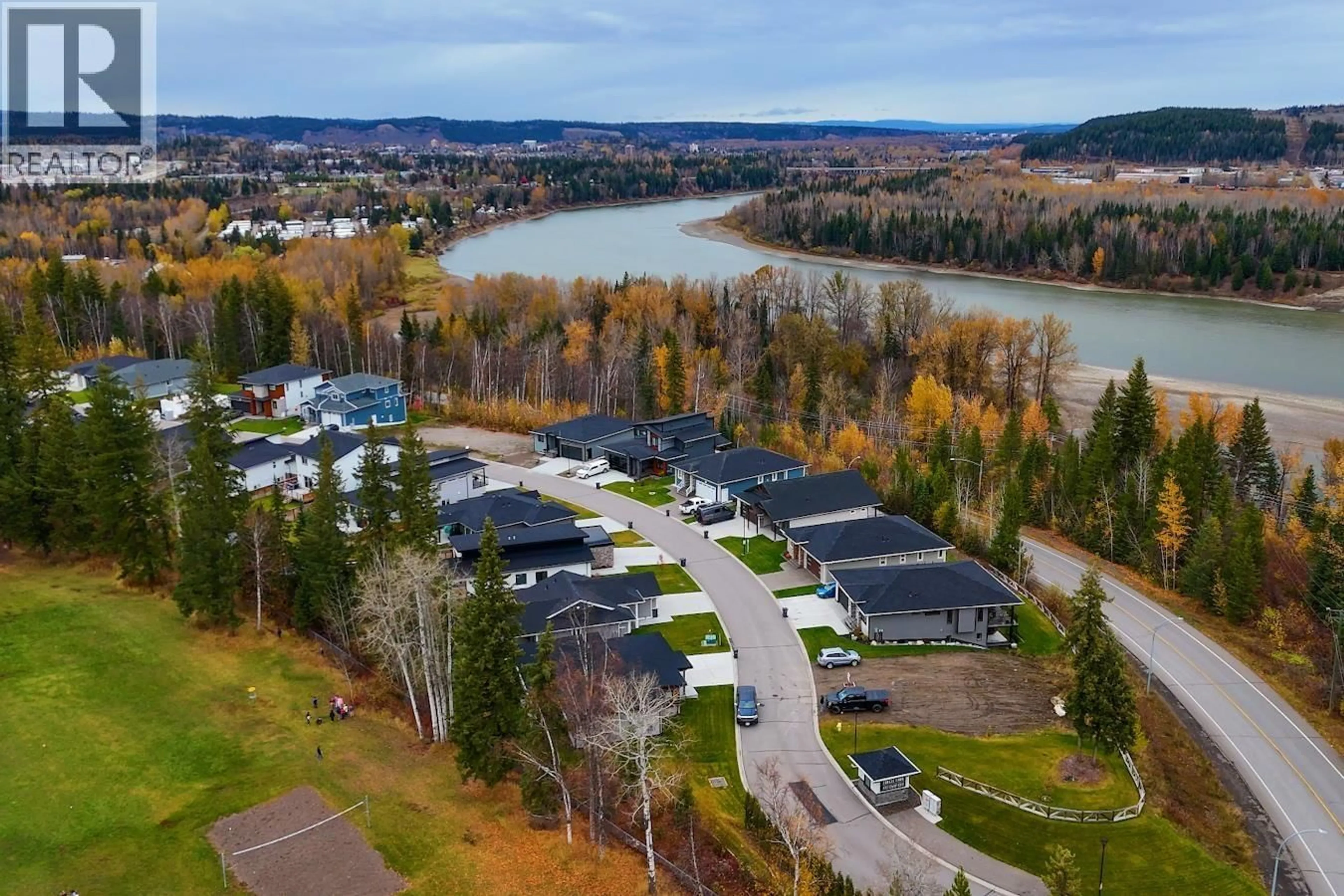 A pic from outside/outdoor area/front of a property/back of a property/a pic from drone, water/lake/river/ocean view for 115 - 4393 COWART ROAD, Prince George British Columbia V2N0H8