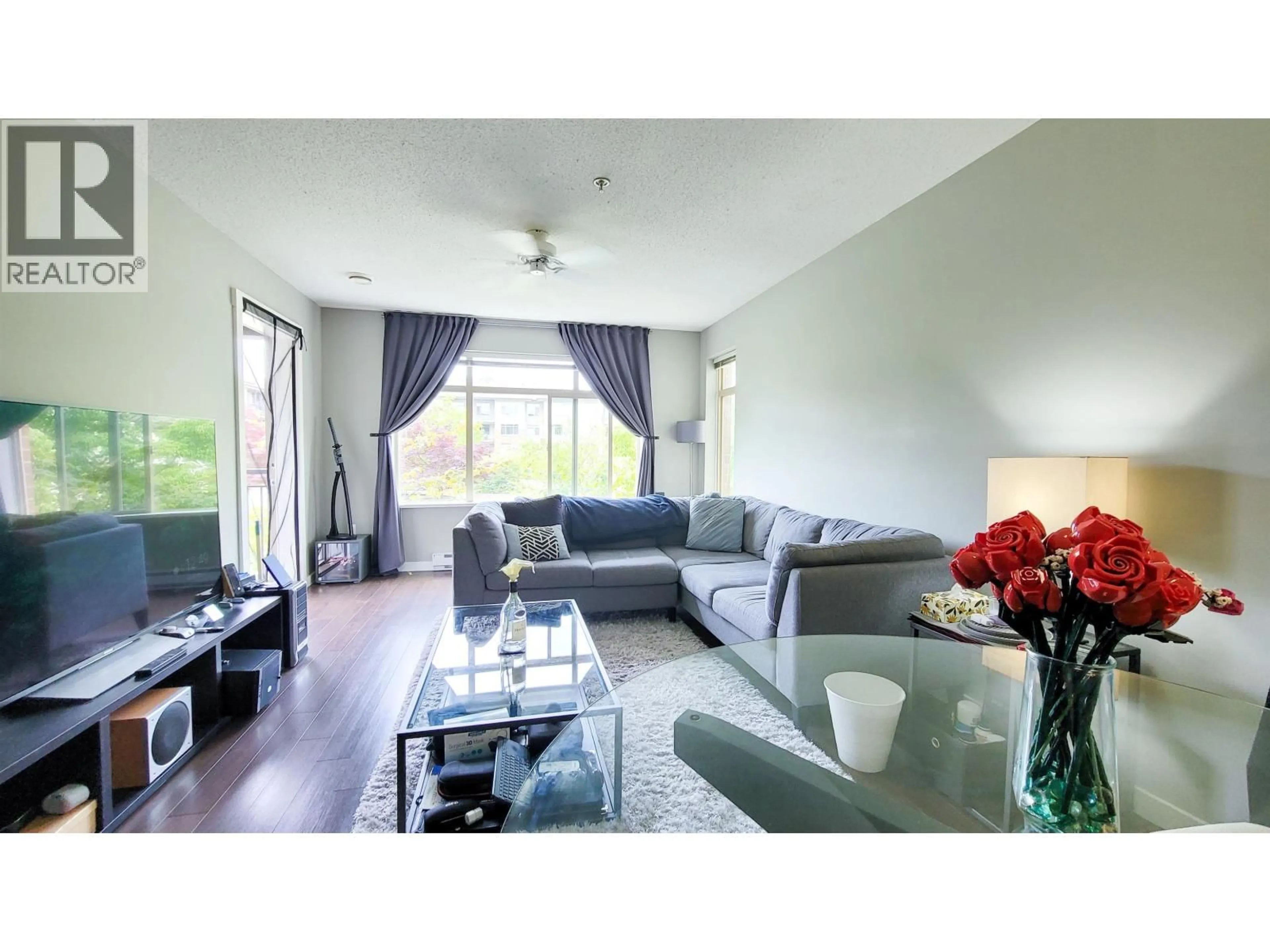 Living room with furniture, wood/laminate floor for 217 - 9299 TOMICKI AVENUE, Richmond British Columbia V6X0C5