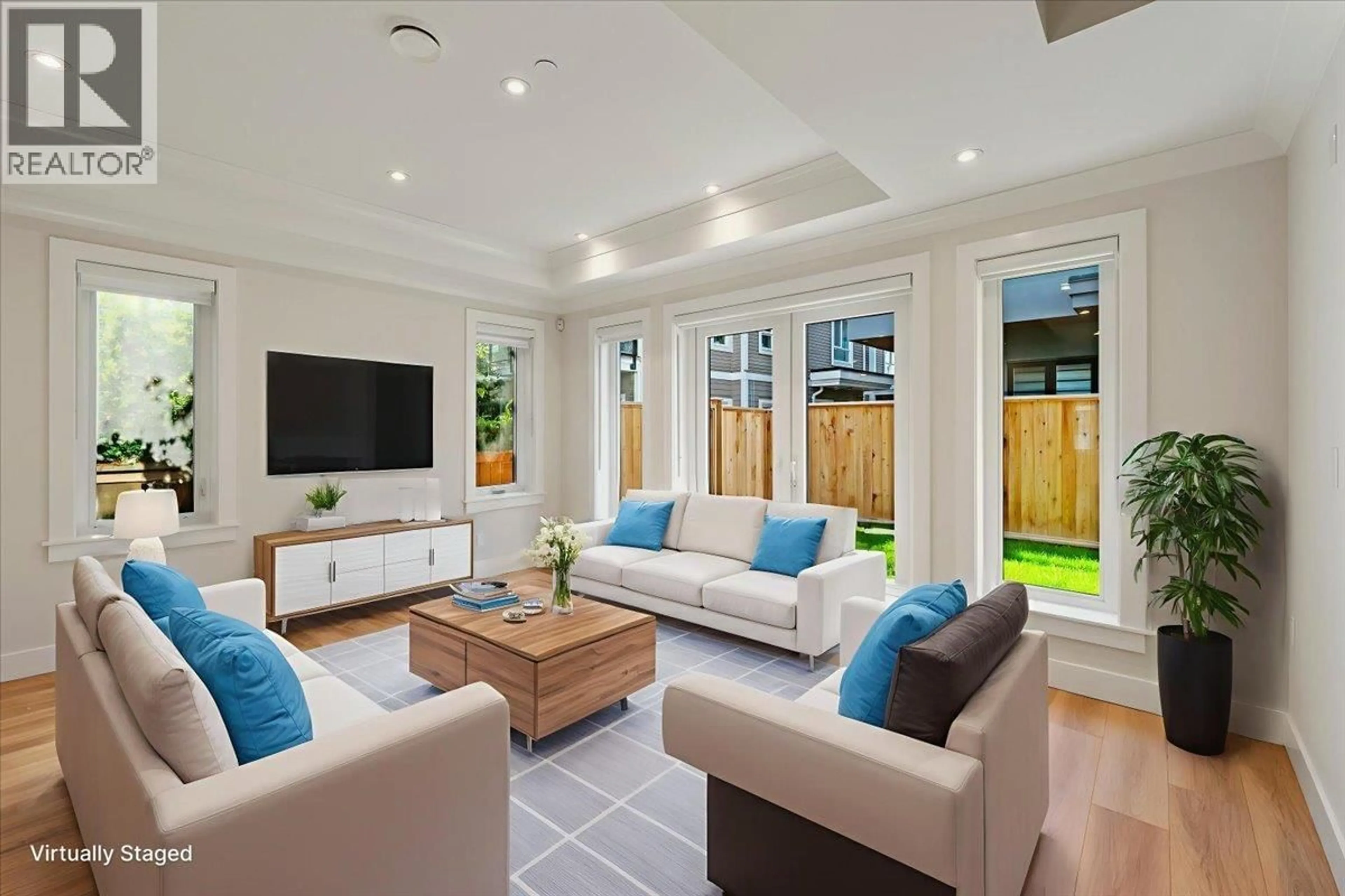Living room with furniture, ceramic/tile floor for 4852 SLOCAN STREET, Vancouver British Columbia V5R2A3
