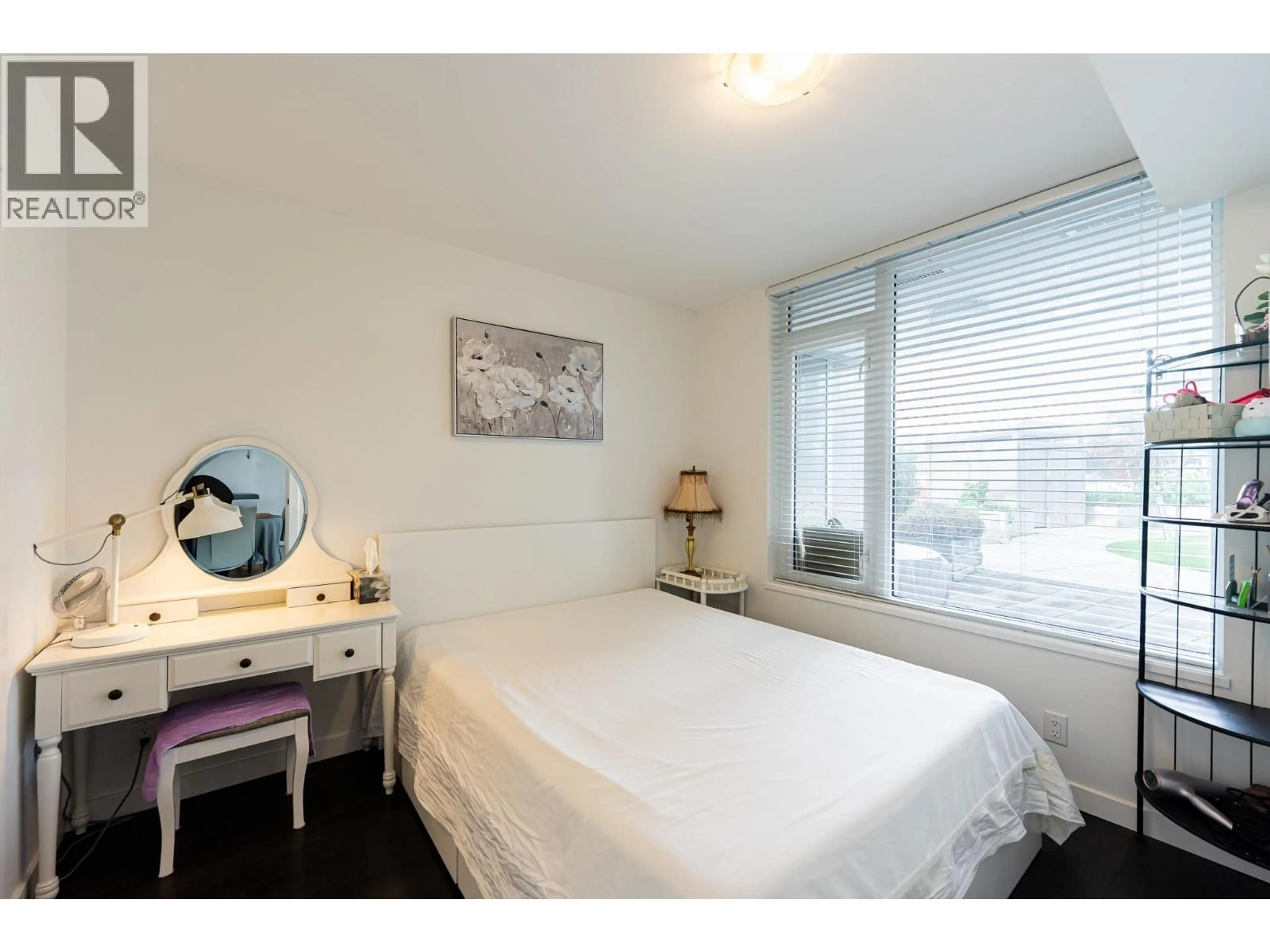 Bedroom with bed, wood/laminate floor for 312 - 7708 ALDERBRIDGE WAY, Richmond British Columbia V6X0P9