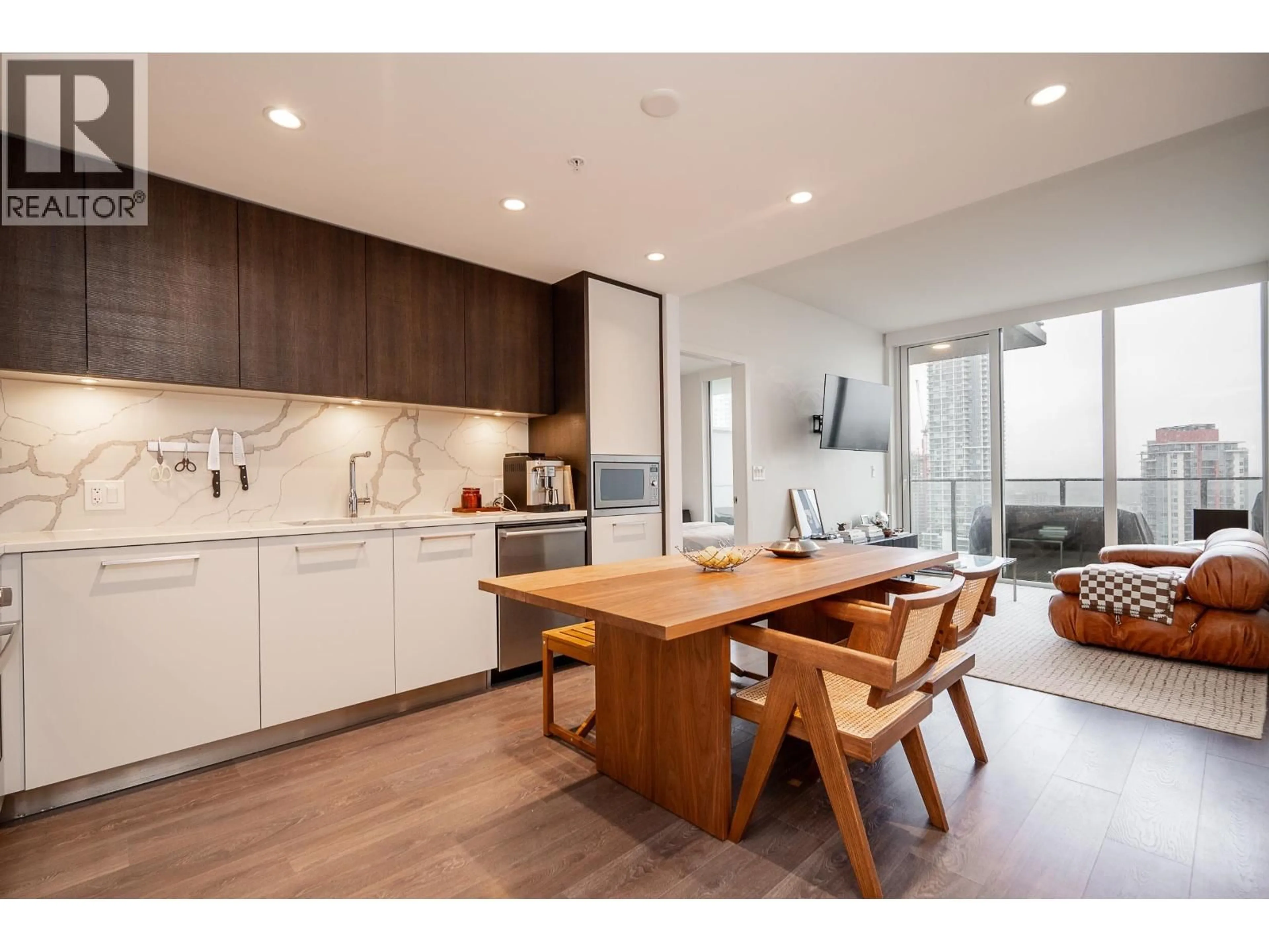 Open concept kitchen, wood/laminate floor for 1701 - 567 CLARKE ROAD, Coquitlam British Columbia V3J0K7