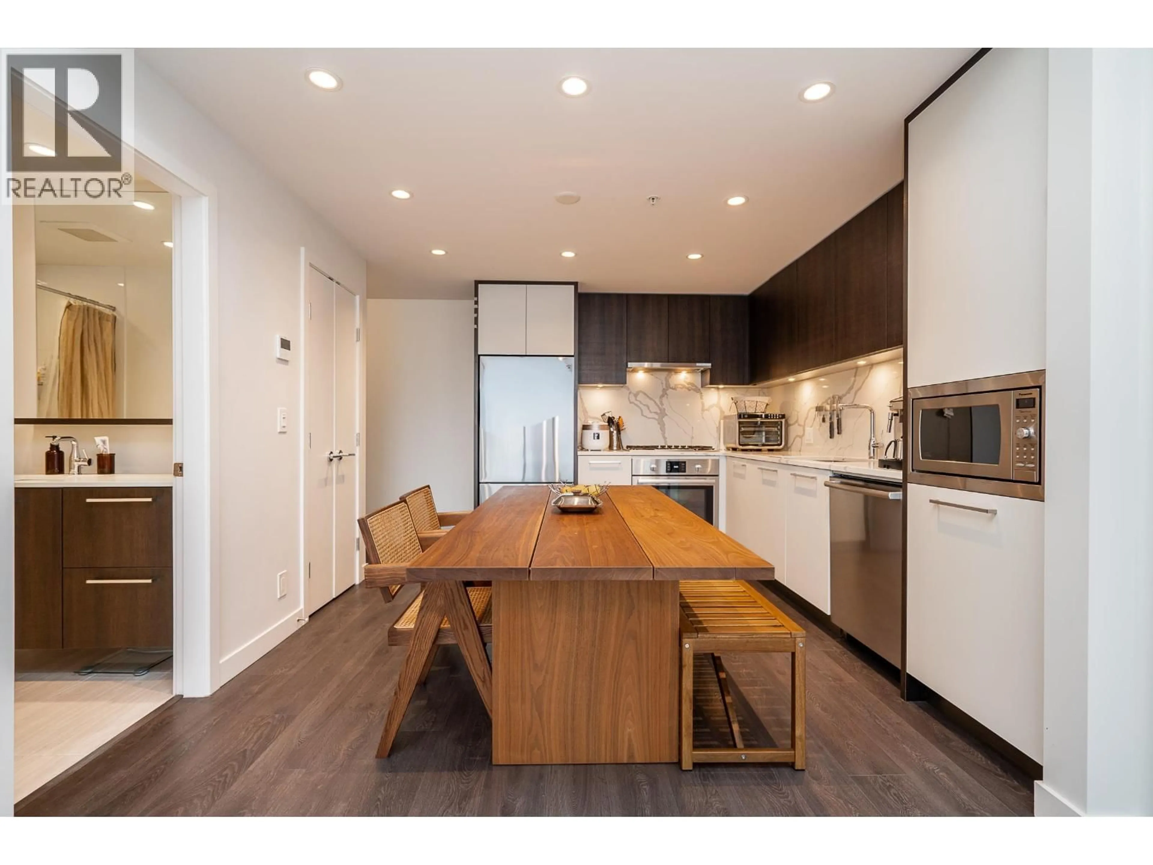 Open concept kitchen, wood/laminate floor for 1701 - 567 CLARKE ROAD, Coquitlam British Columbia V3J0K7