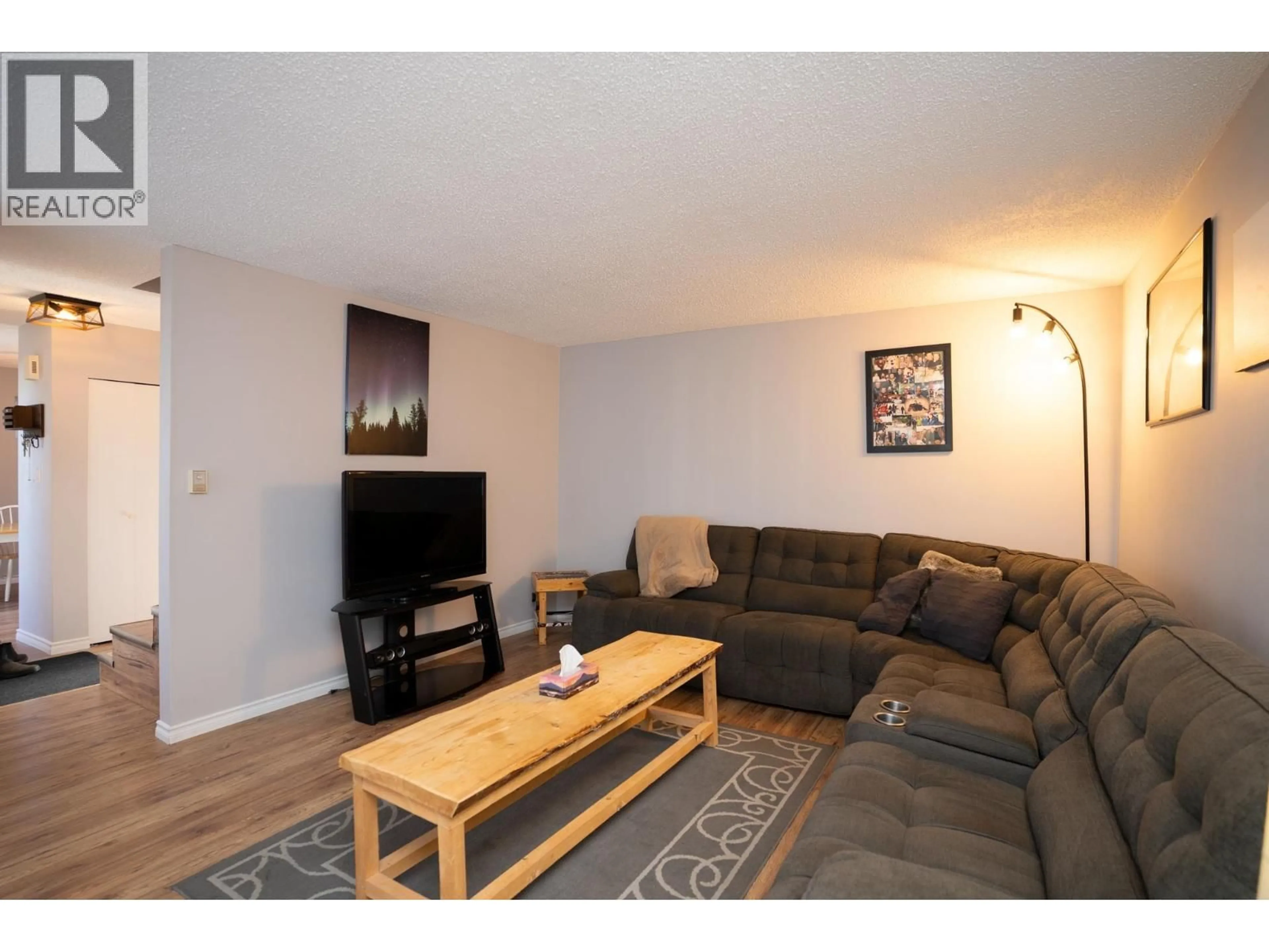 Living room with furniture, wood/laminate floor for 7935 ROCHESTER CRESCENT, Prince George British Columbia V2N3V7