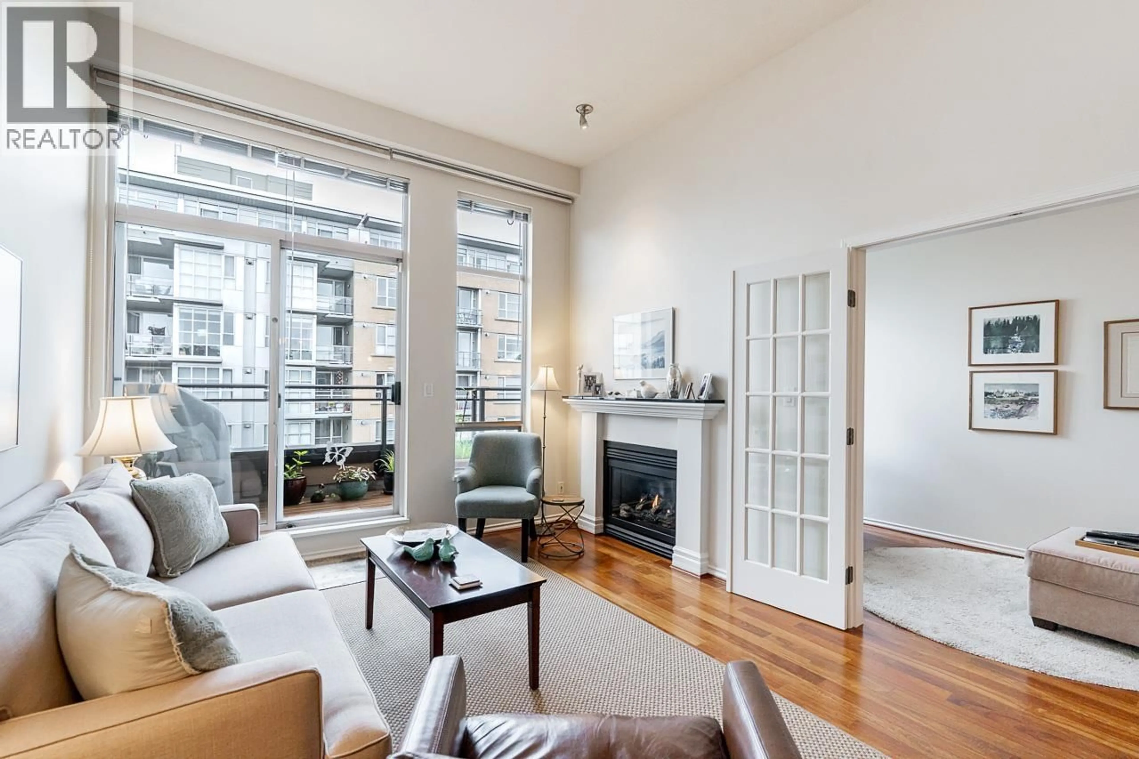 Living room with furniture, wood/laminate floor for 402 - 2175 SALAL DRIVE, Vancouver British Columbia V6K4V2