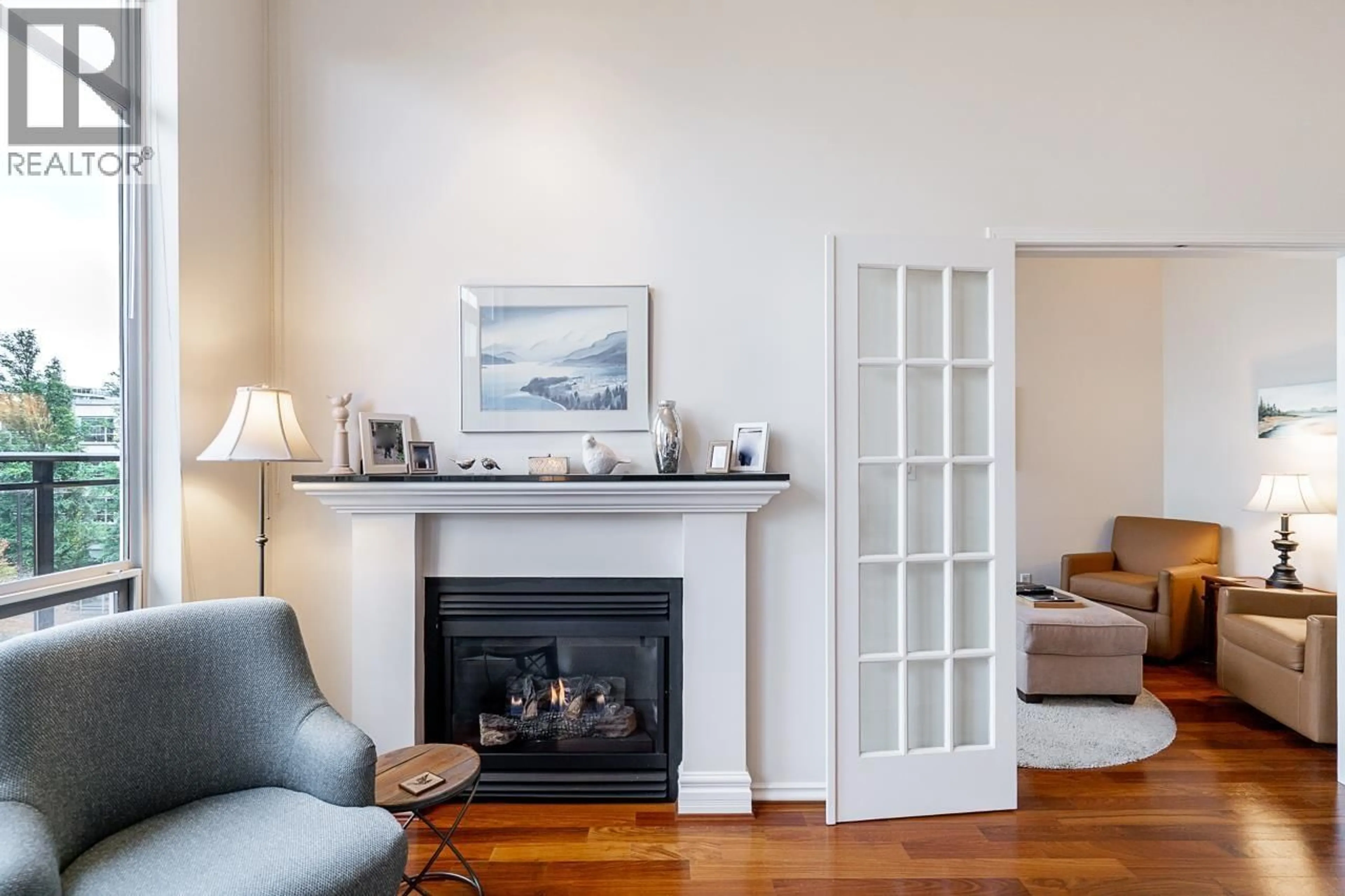 Living room with furniture, wood/laminate floor for 402 - 2175 SALAL DRIVE, Vancouver British Columbia V6K4V2