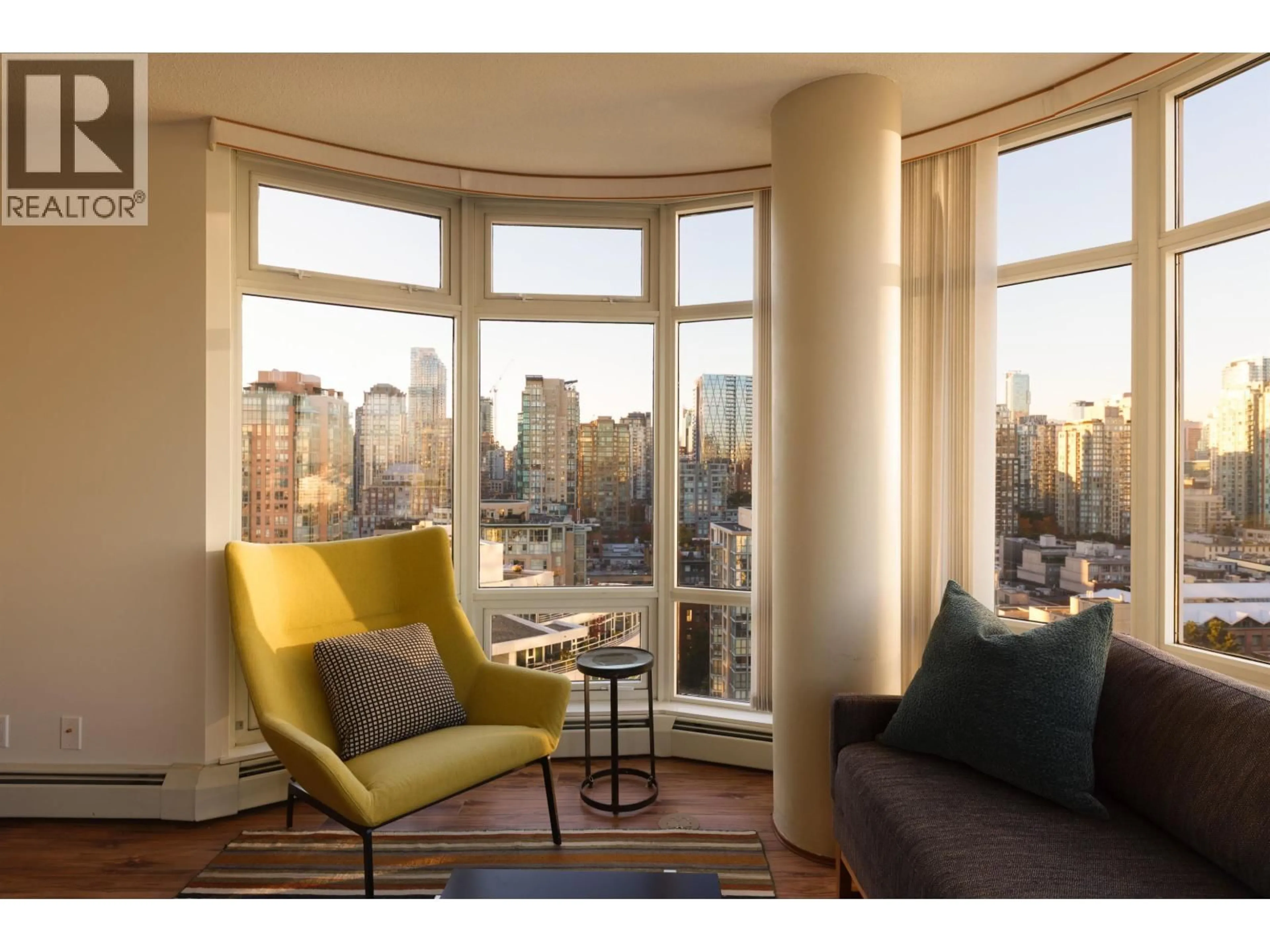 Living room with furniture, wood/laminate floor for 2305 - 1199 MARINASIDE CRESCENT, Vancouver British Columbia V6Z2Y2