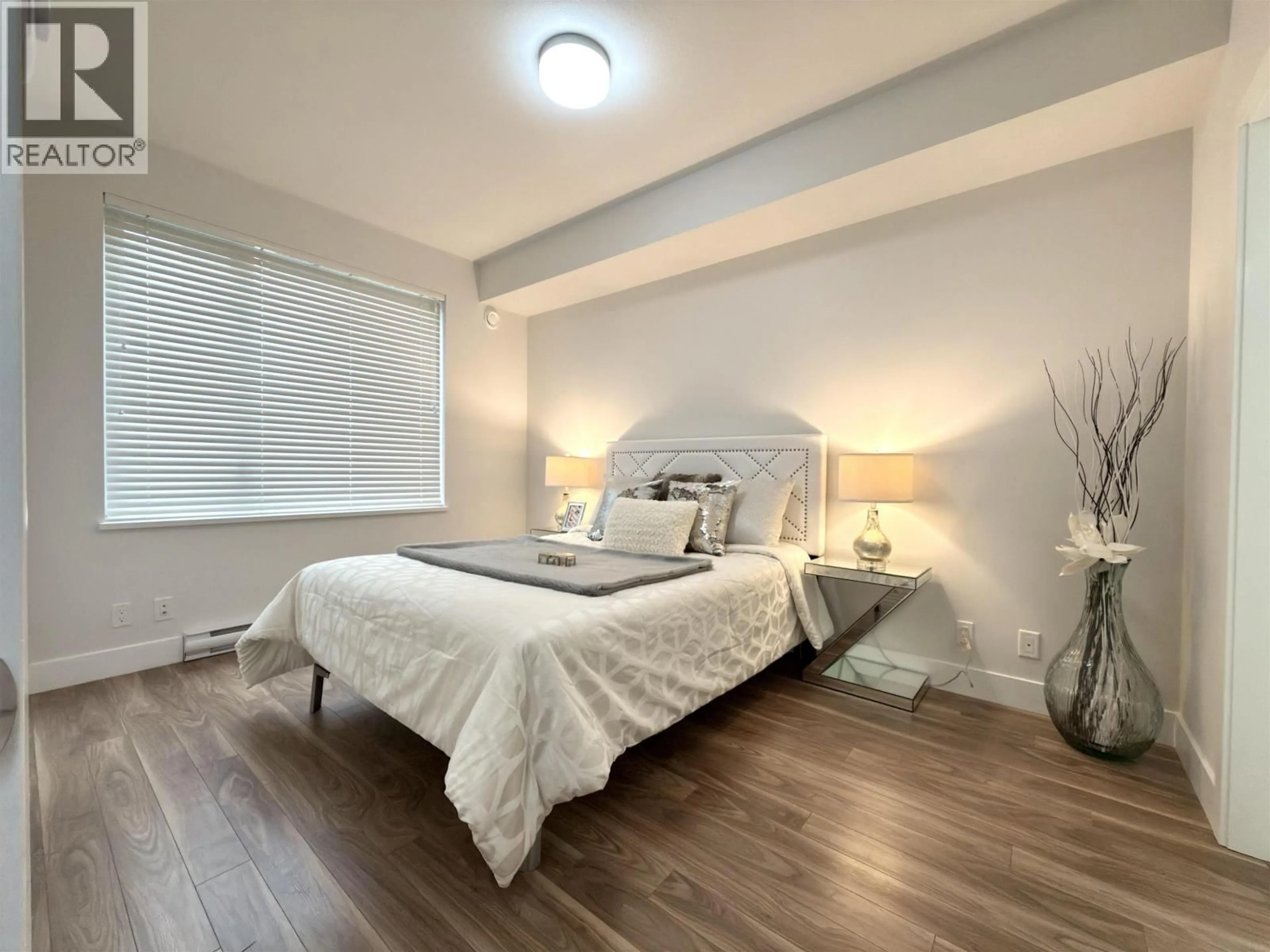 Bedroom with bed, wood/laminate floor for 317 - 5355 LANE STREET, Burnaby British Columbia V5H0H1