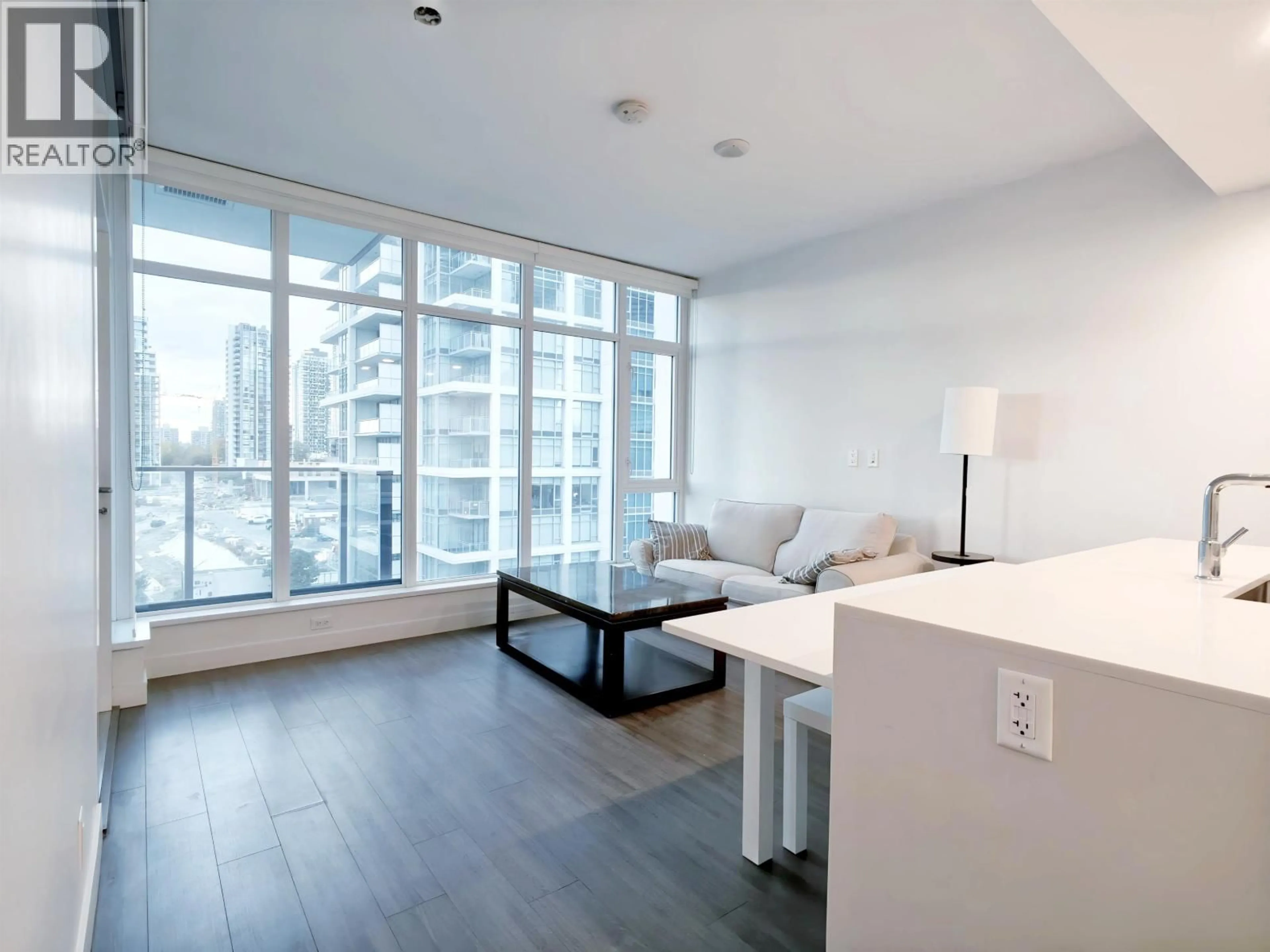 Living room with furniture, wood/laminate floor for 809 - 2311 BETA AVENUE, Burnaby British Columbia V5C0M1