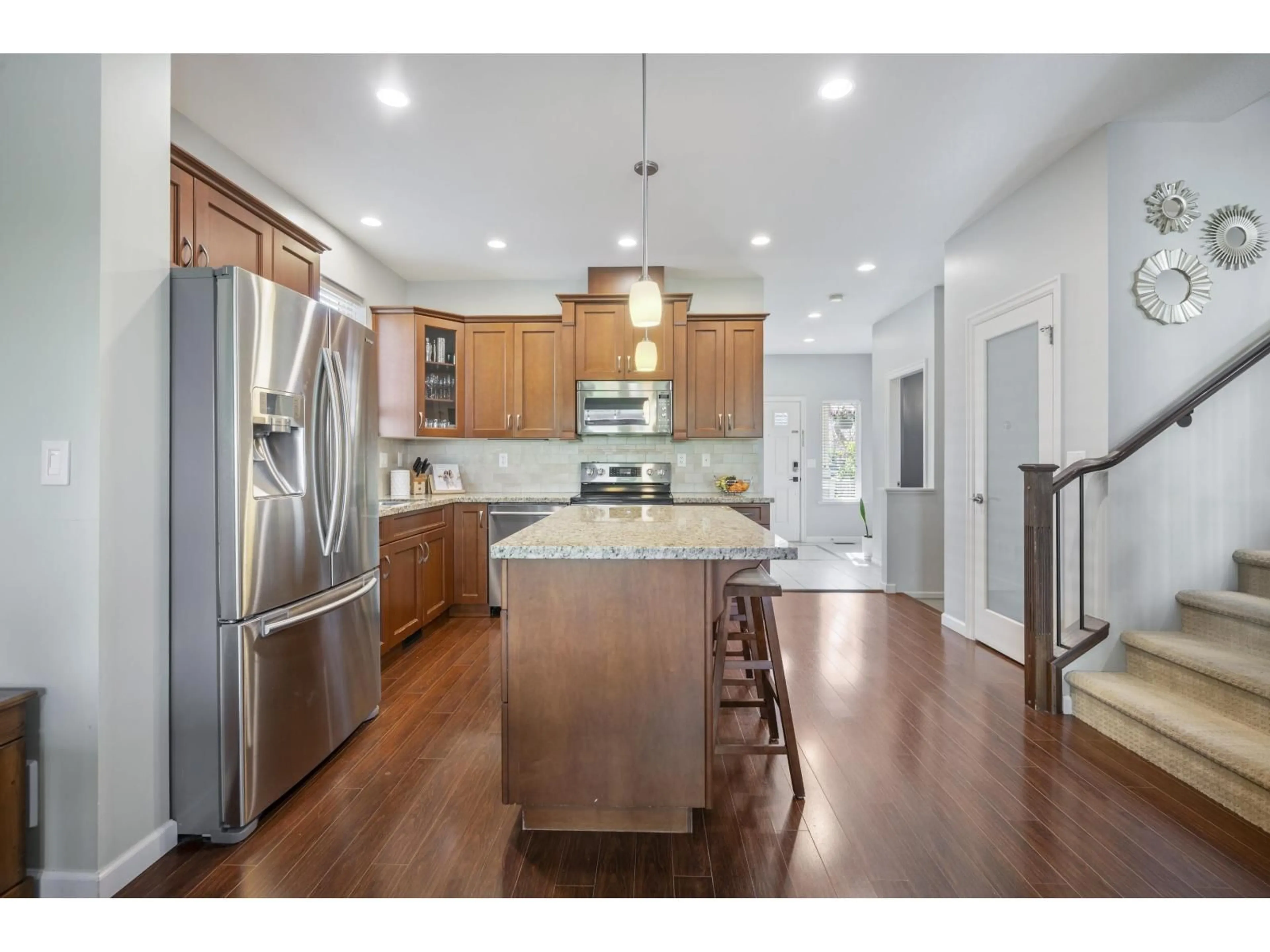 Open concept kitchen, wood/laminate floor for 6867 208A, Langley British Columbia V2Y0G2