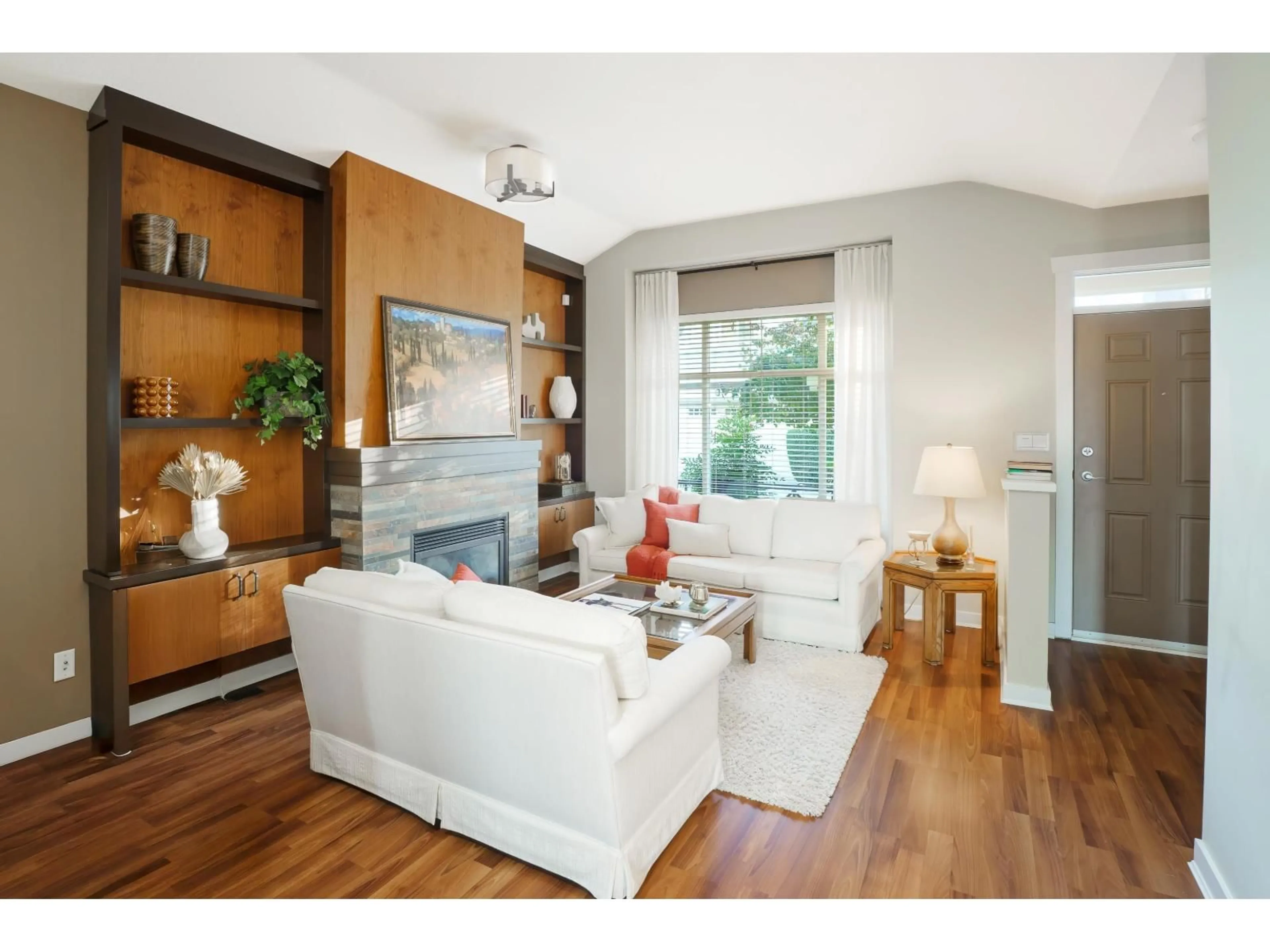 Living room with furniture, wood/laminate floor for 35 - 15188 62A, Surrey British Columbia V3S1W7