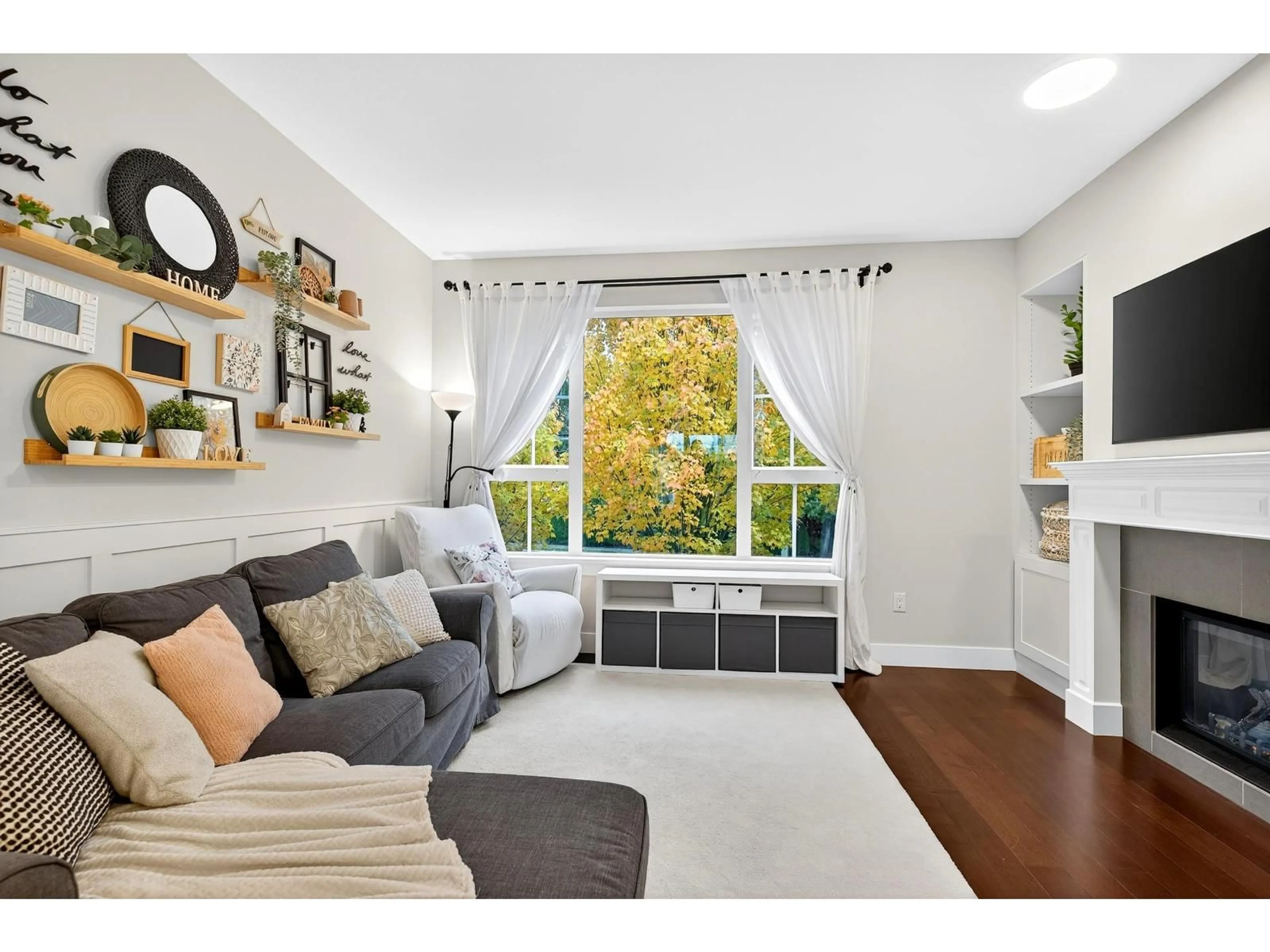 Living room with furniture, wood/laminate floor for 153 - 2501 161A, Surrey British Columbia V3Z7Y6