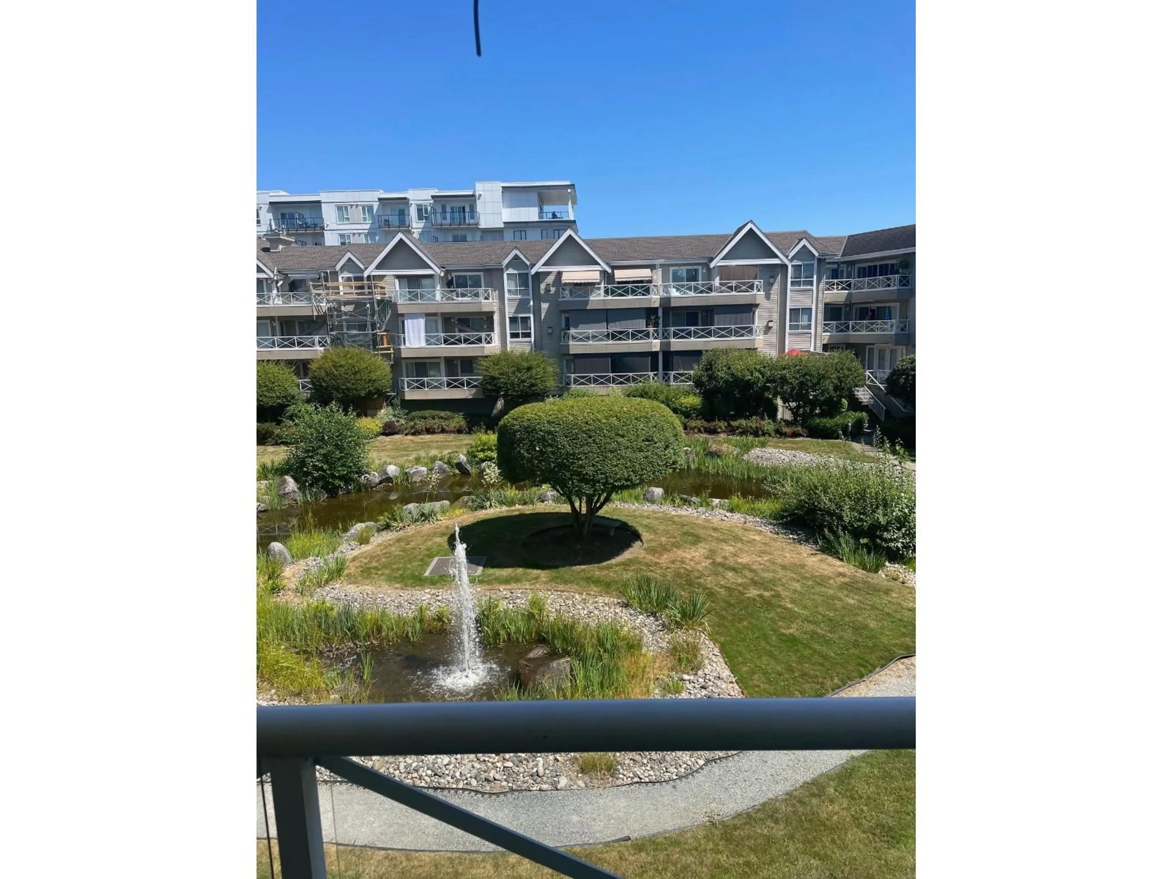 A pic from outside/outdoor area/front of a property/back of a property/a pic from drone, water/lake/river/ocean view for 203 - 5556 201A, Langley British Columbia V3A8K5