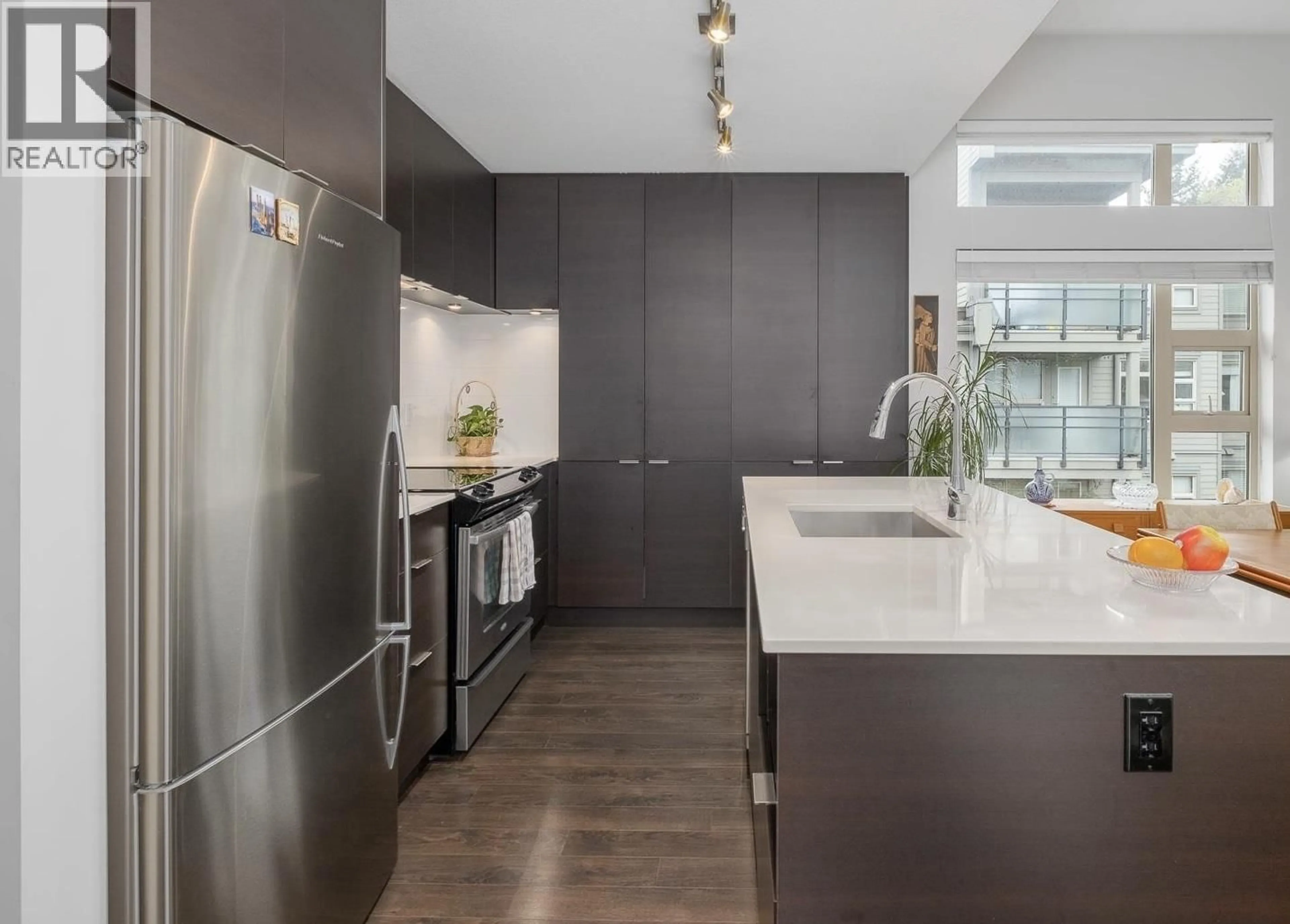 Contemporary kitchen, unknown for 410 - 1673 LLOYD AVENUE, North Vancouver British Columbia V7P0A9
