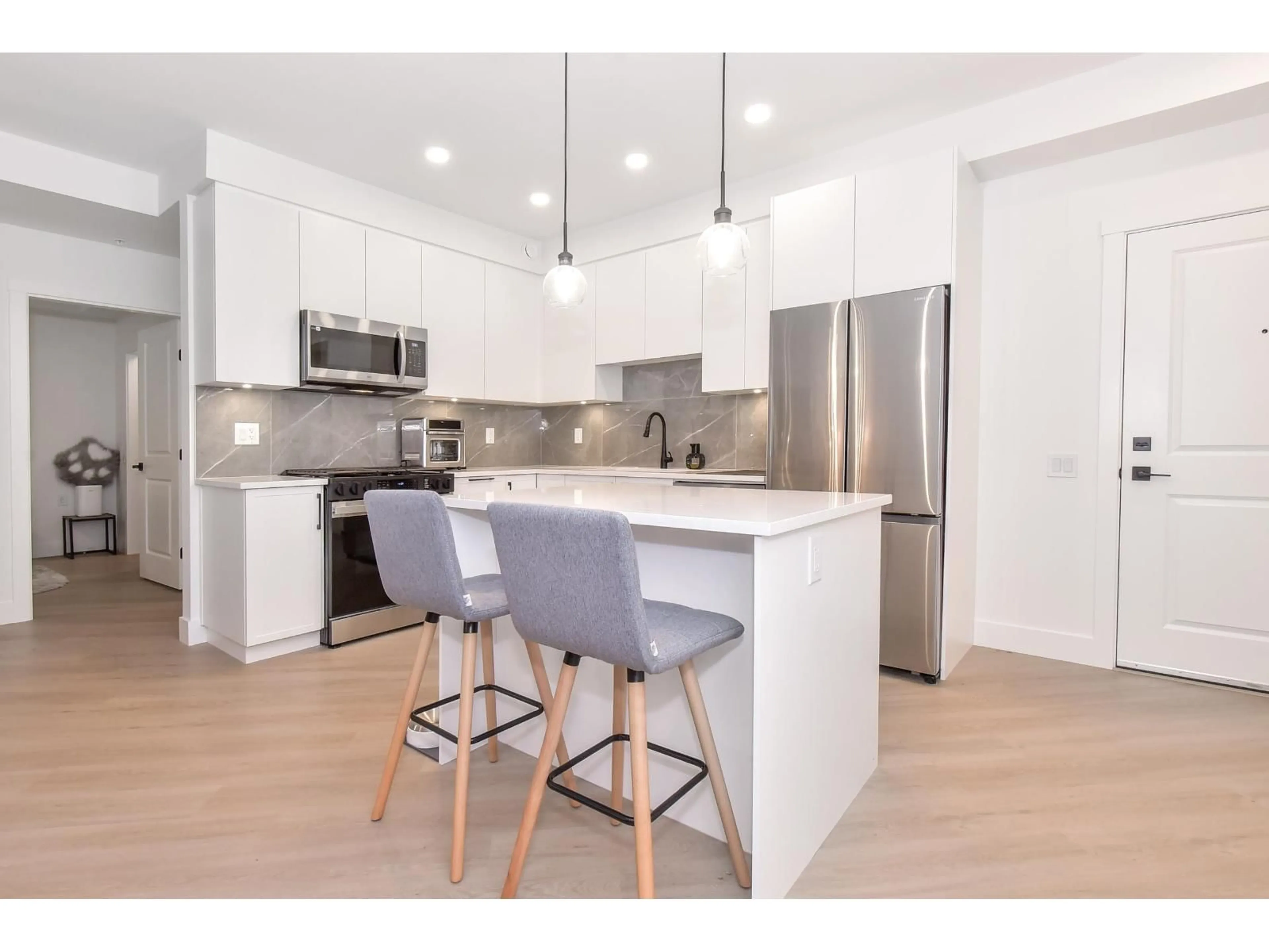 Open concept kitchen, unknown for 311 - 3438 146A, Surrey British Columbia V4P0J1