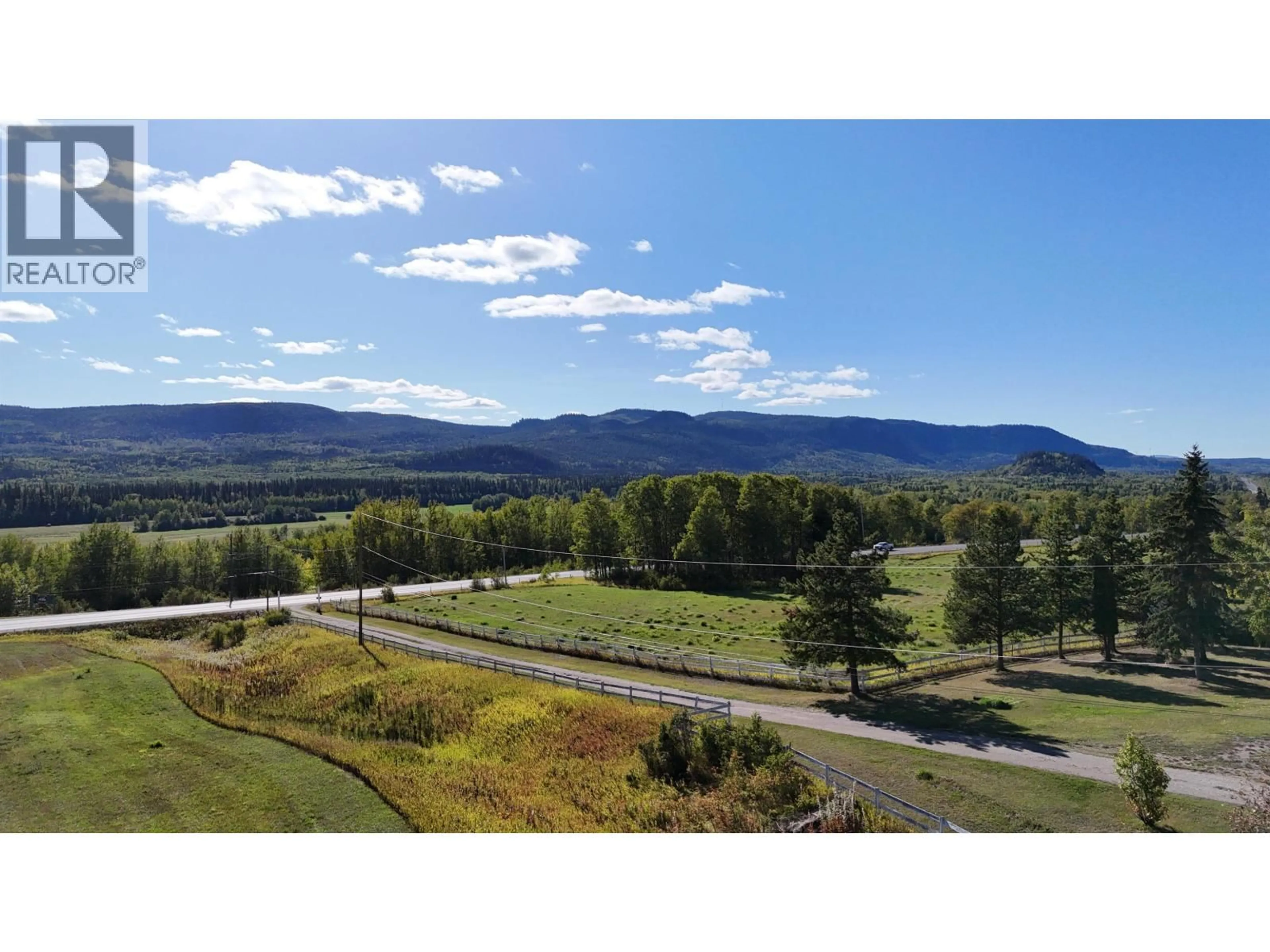 A pic from outside/outdoor area/front of a property/back of a property/a pic from drone, mountain view for 21900 16 HIGHWAY, Fort Fraser British Columbia V0J3A0