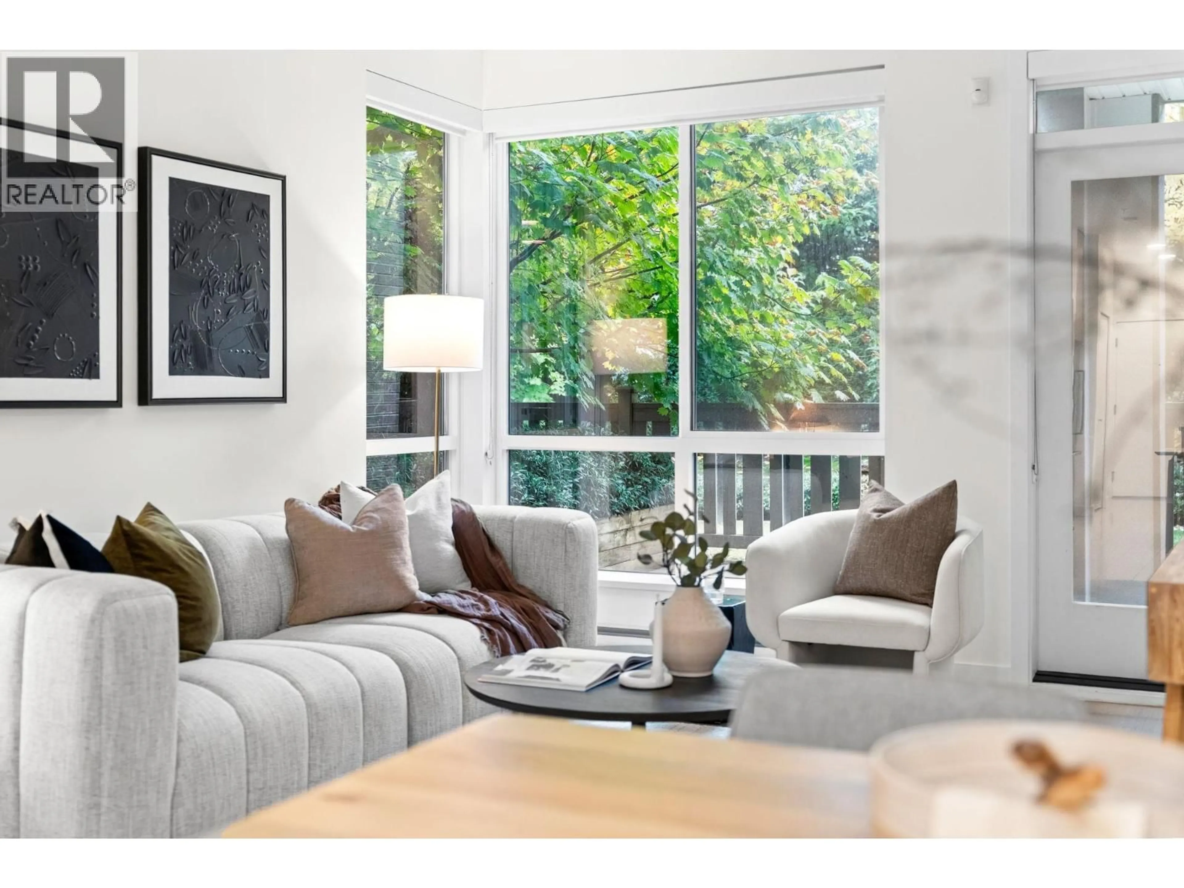 Living room with furniture, wood/laminate floor for 103 - 5460 BROADWAY, Burnaby British Columbia V5B0B4