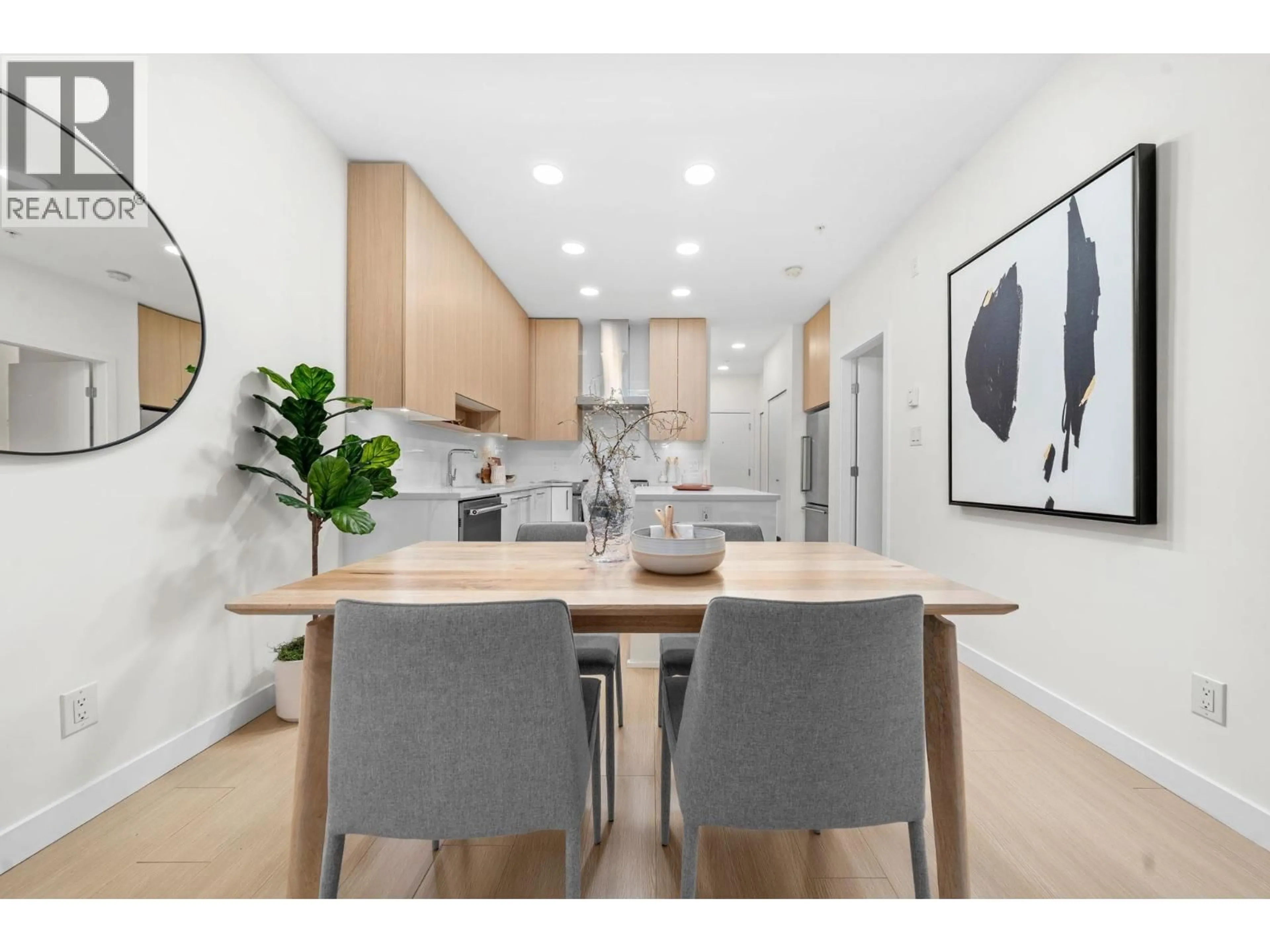 Open concept kitchen, wood/laminate floor for 103 - 5460 BROADWAY, Burnaby British Columbia V5B0B4