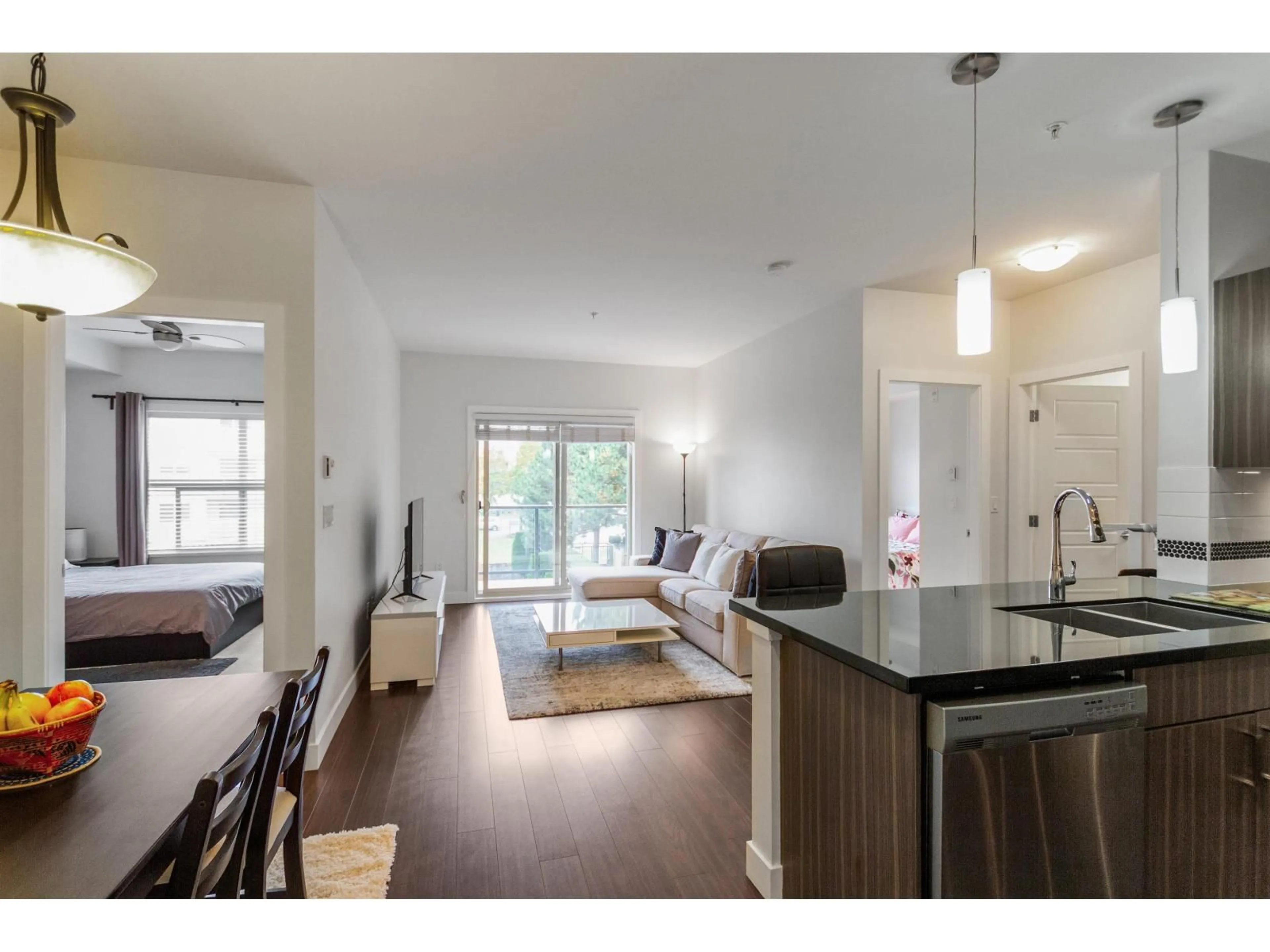 Open concept kitchen, wood/laminate floor for 210 - 20219 54A, Langley British Columbia V3A0C7