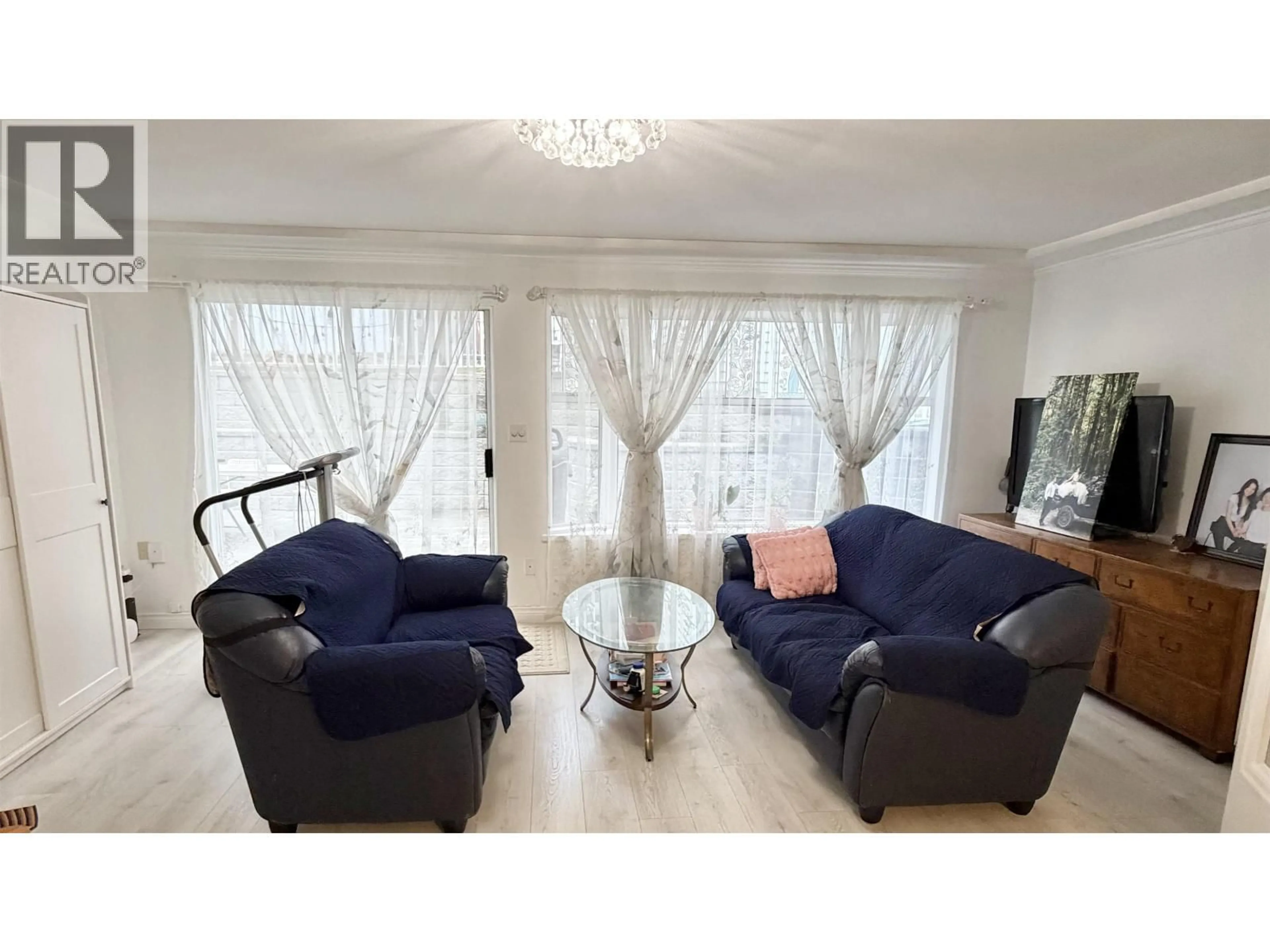 Living room with furniture, wood/laminate floor for 111 SAPPER STREET, New Westminster British Columbia V3L3Y6