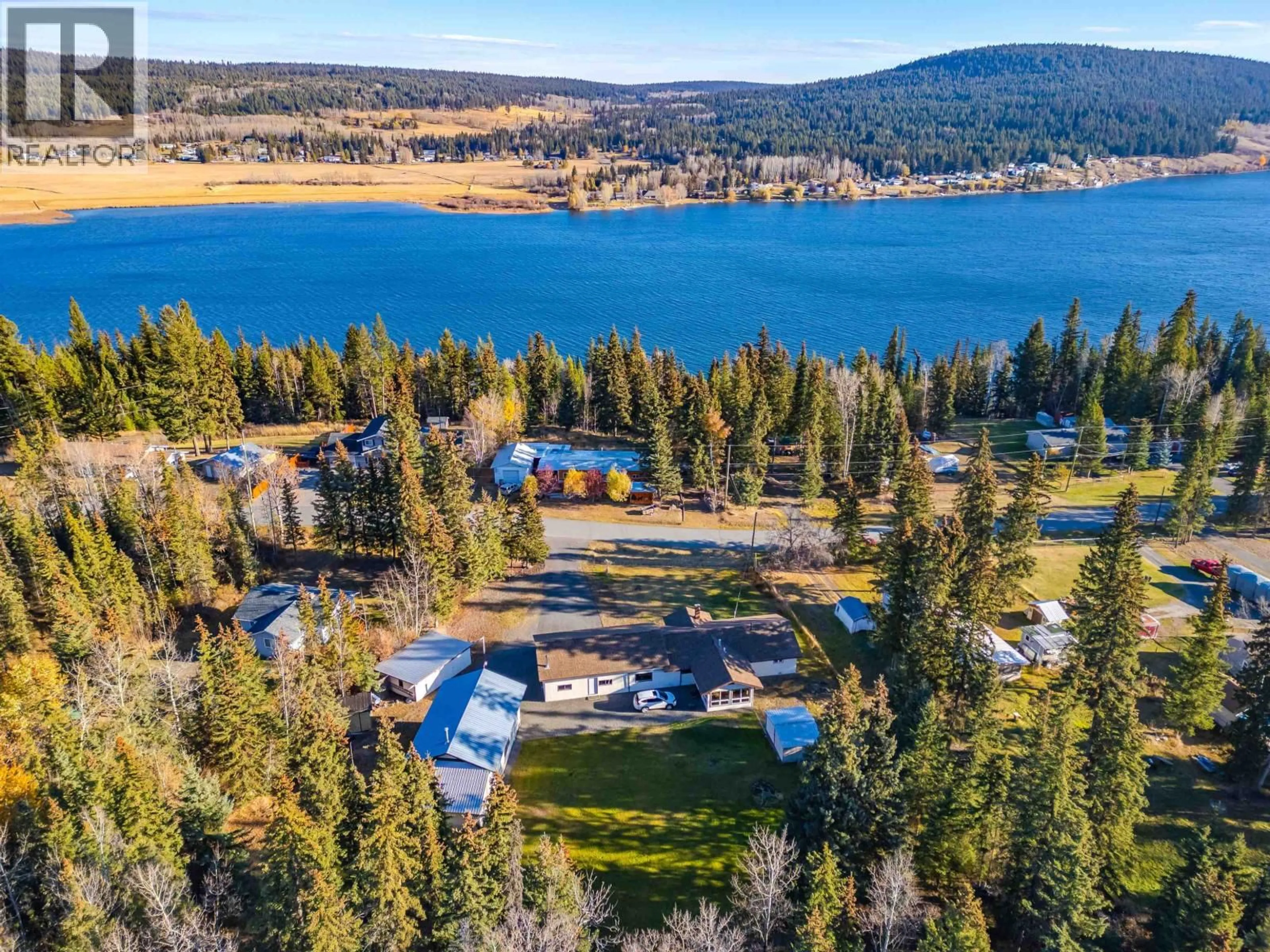 A pic from outside/outdoor area/front of a property/back of a property/a pic from drone, water/lake/river/ocean view for 6056 NORMAN ROAD, Horse Lake British Columbia V0K2E3