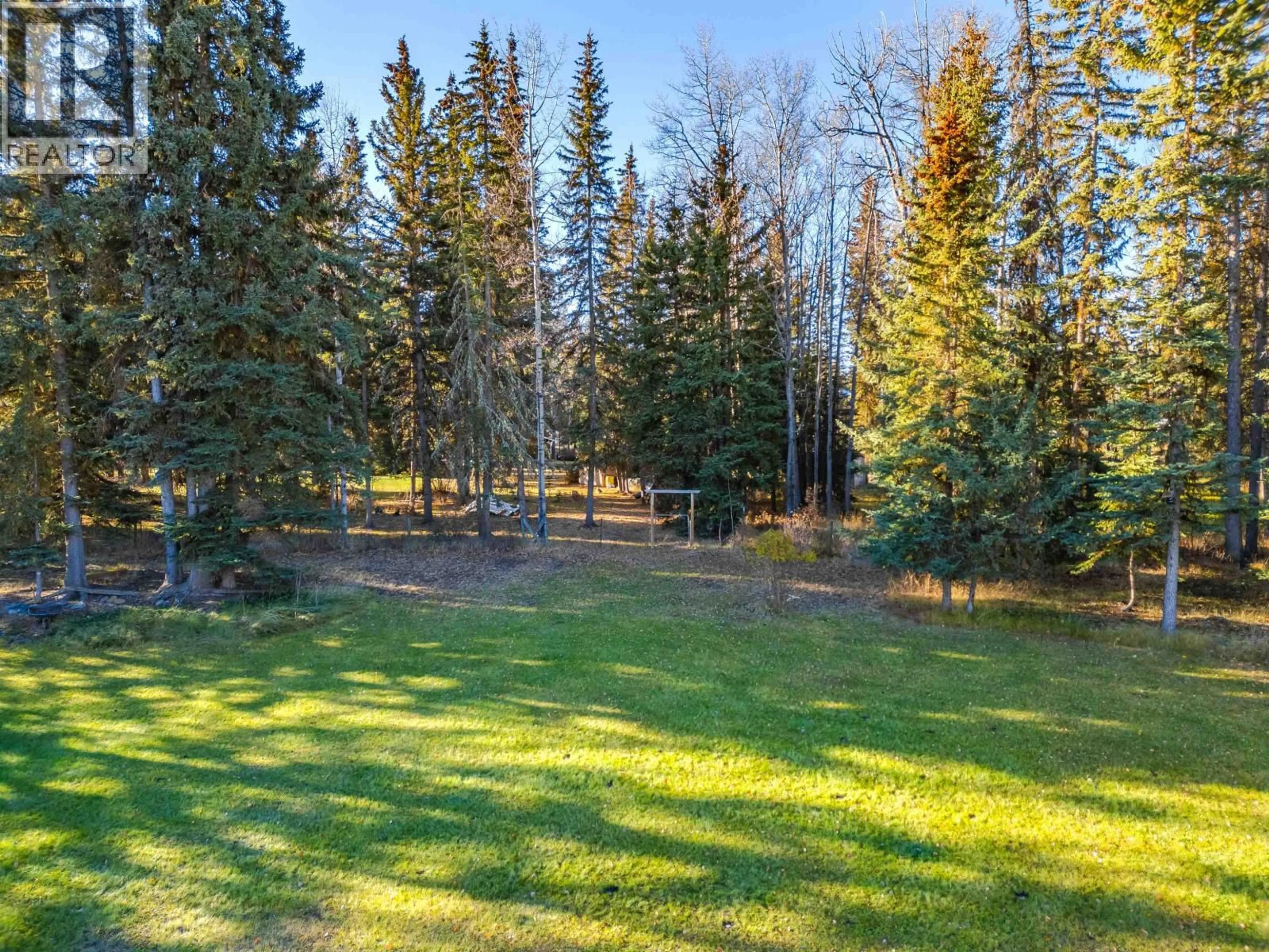 A pic from outside/outdoor area/front of a property/back of a property/a pic from drone, forest/trees view for 6056 NORMAN ROAD, Horse Lake British Columbia V0K2E3