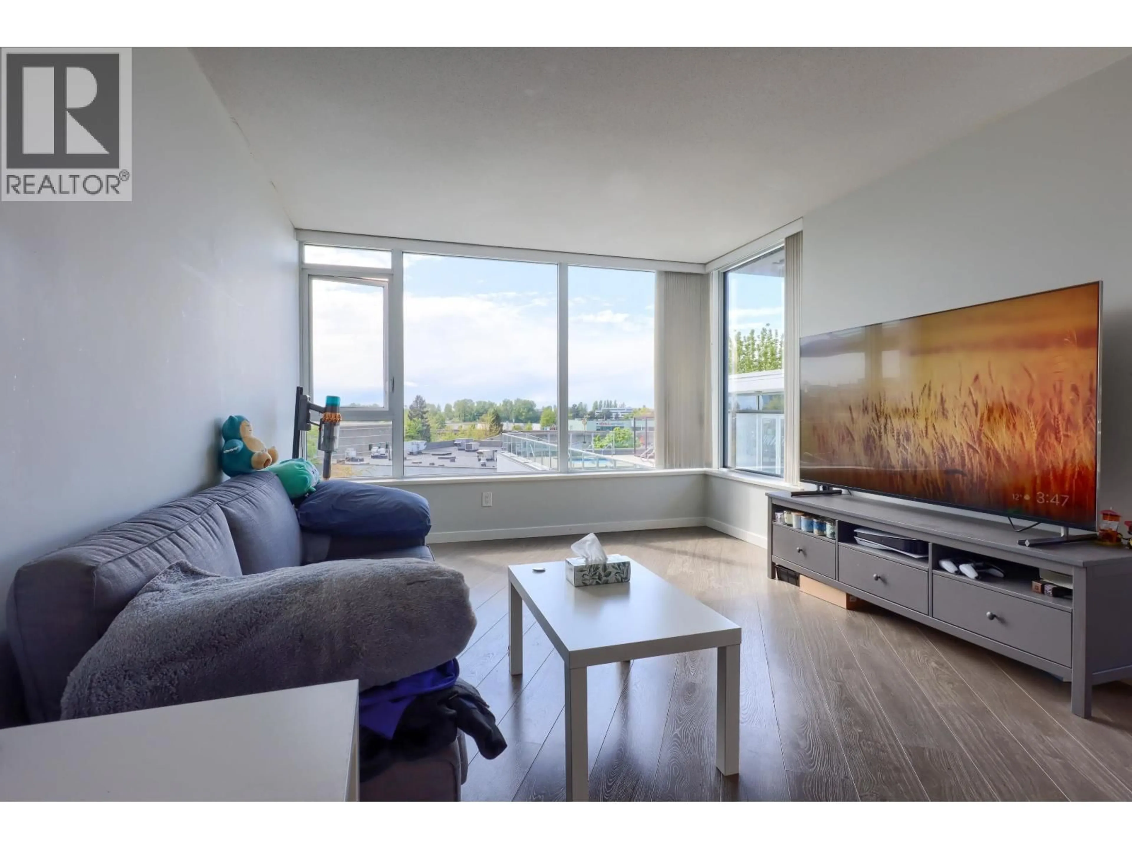Living room with furniture, wood/laminate floor for 617 - 8333 SWEET AVENUE, Richmond British Columbia V6X0P4