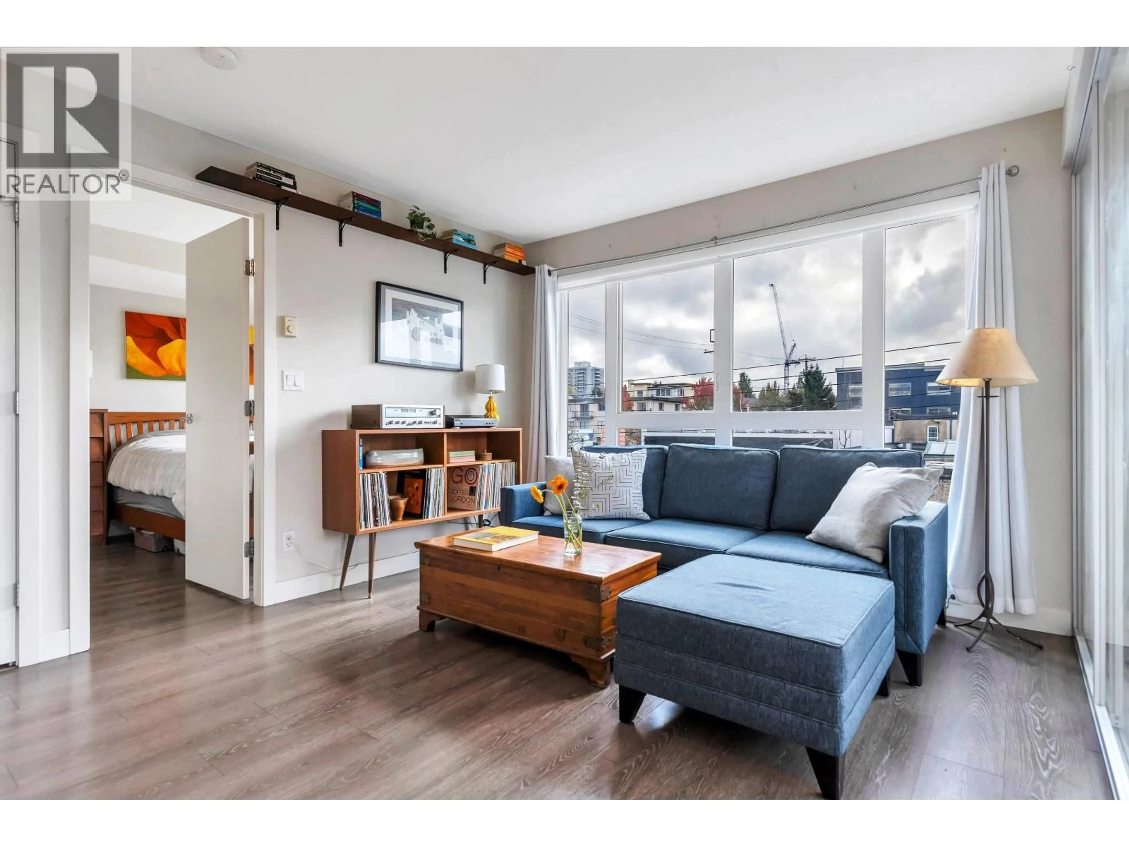 Living room with furniture, wood/laminate floor for 329 - 1588 HASTINGS STREET, Vancouver British Columbia V5L0B8