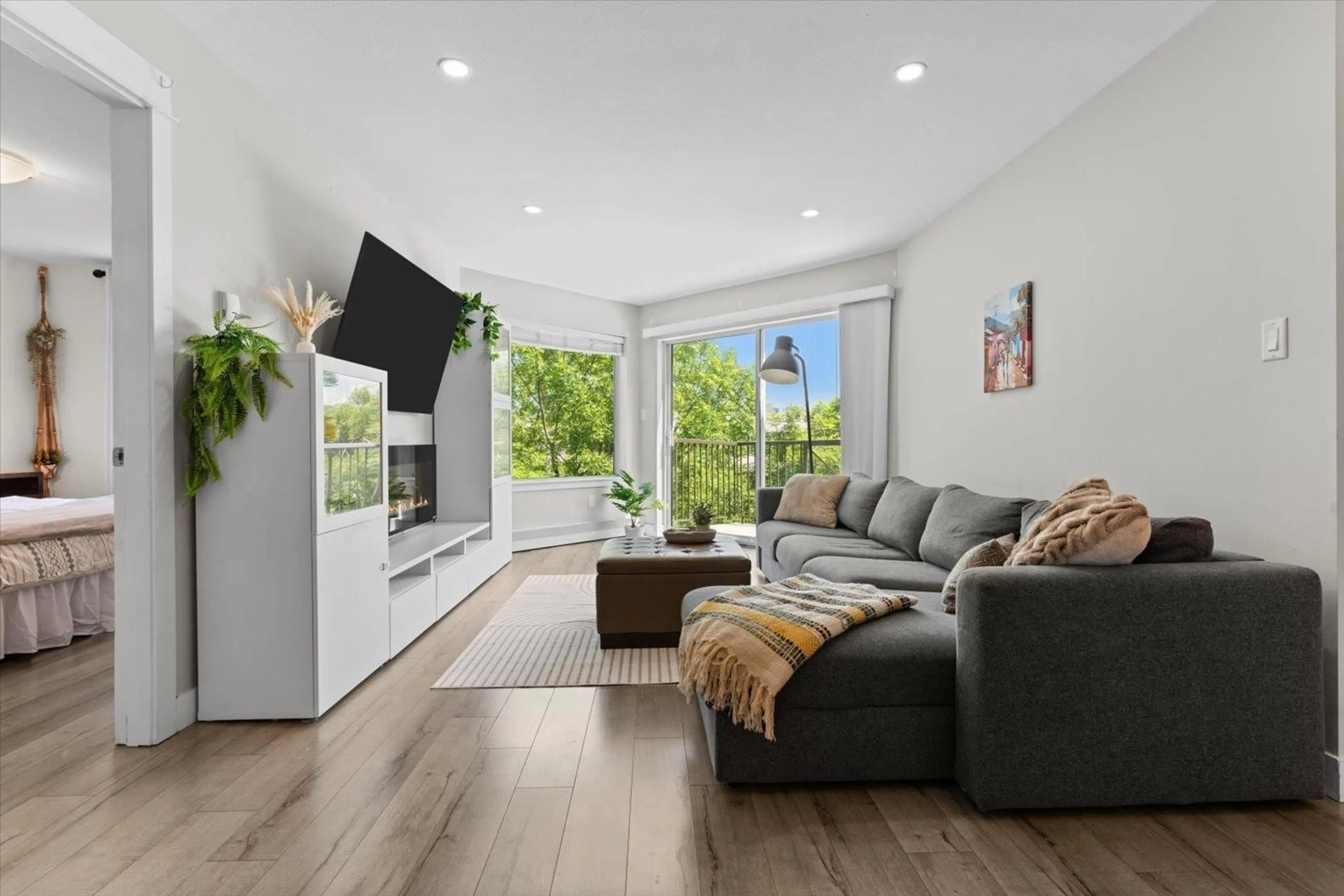 Living room with furniture, wood/laminate floor for 306 - 32725 GEORGE FERGUSON, Abbotsford British Columbia V2T5M5