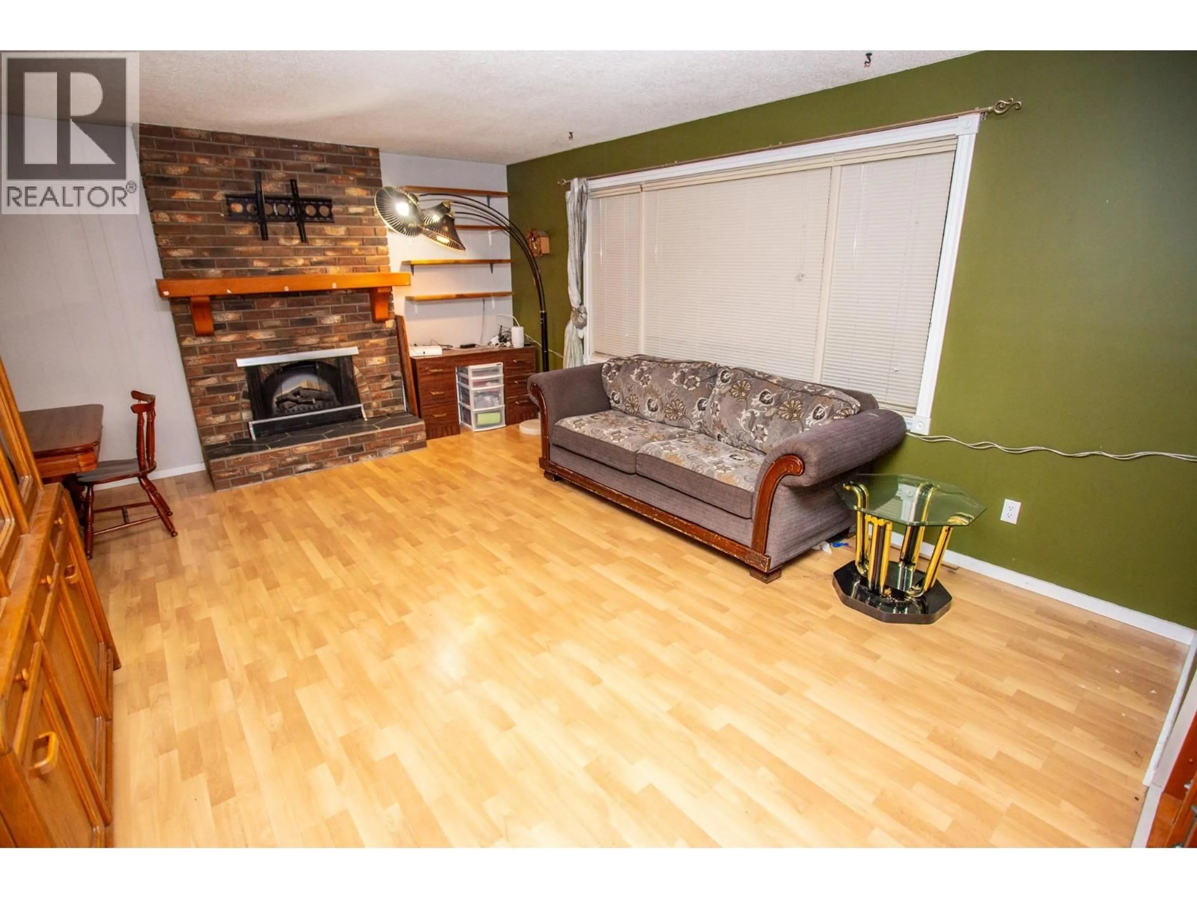Living room with furniture, wood/laminate floor for 7386 IMPERIAL PLACE, Prince George British Columbia V2N2T9