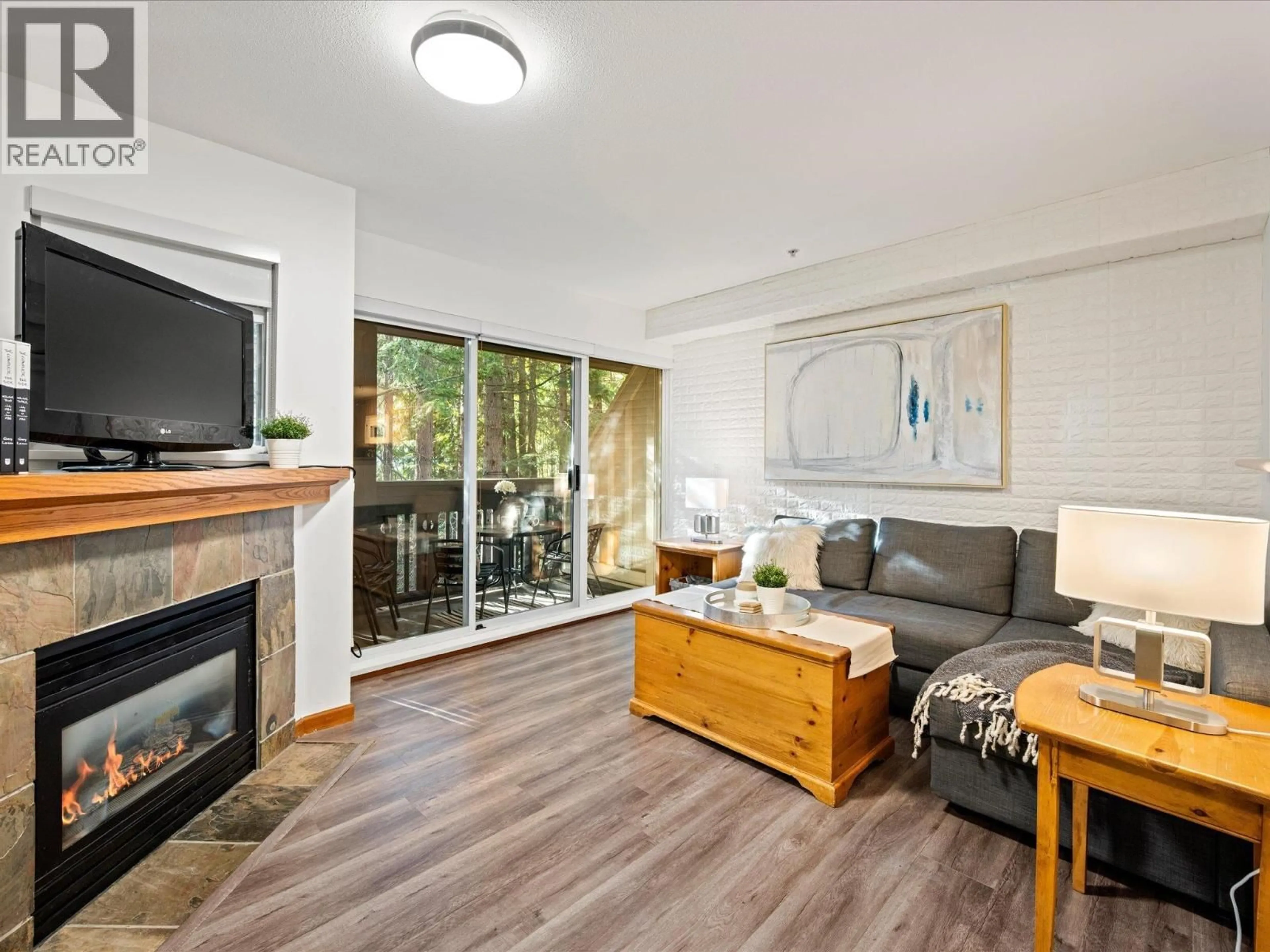 Living room with furniture, wood/laminate floor for 2 - 4335 NORTHLANDS BOULEVARD, Whistler British Columbia V0N1B4