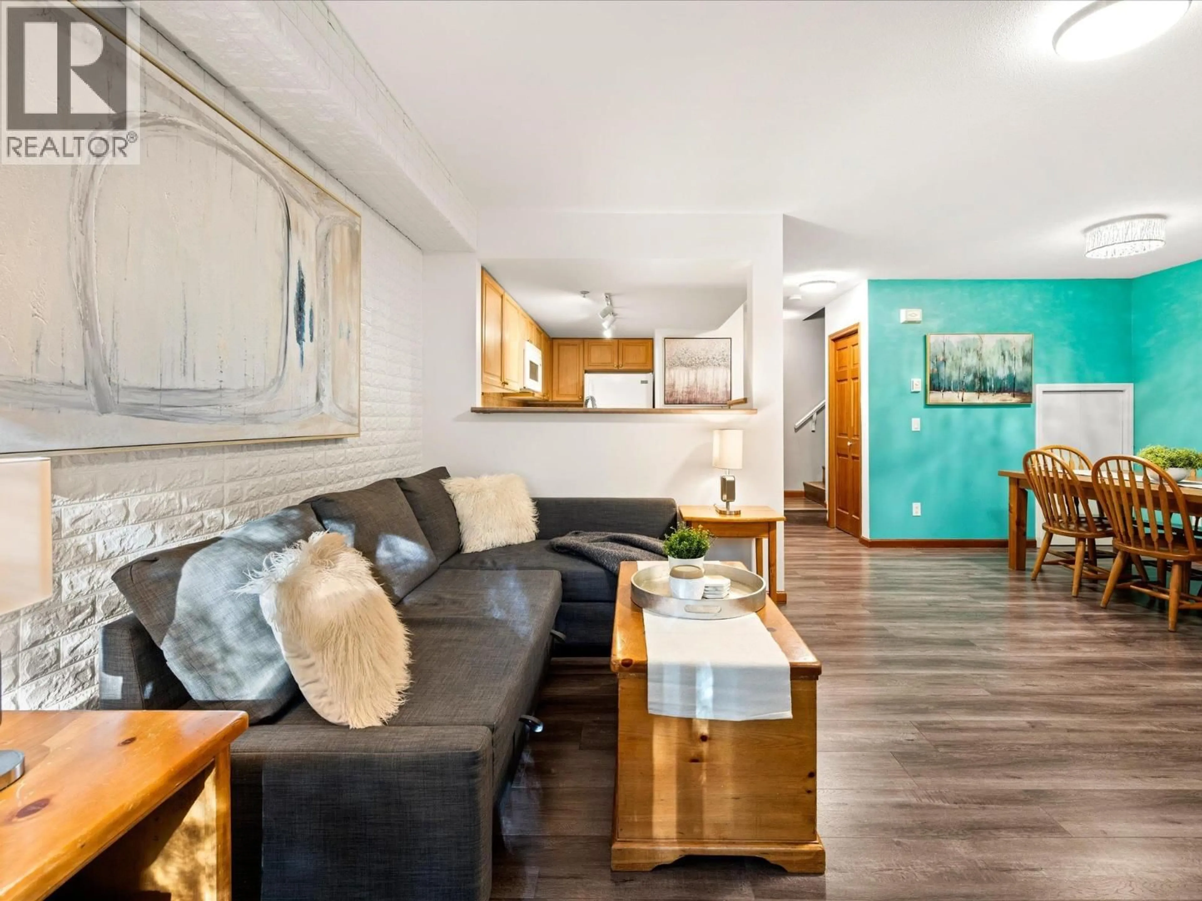 Living room with furniture, wood/laminate floor for 2 - 4335 NORTHLANDS BOULEVARD, Whistler British Columbia V0N1B4