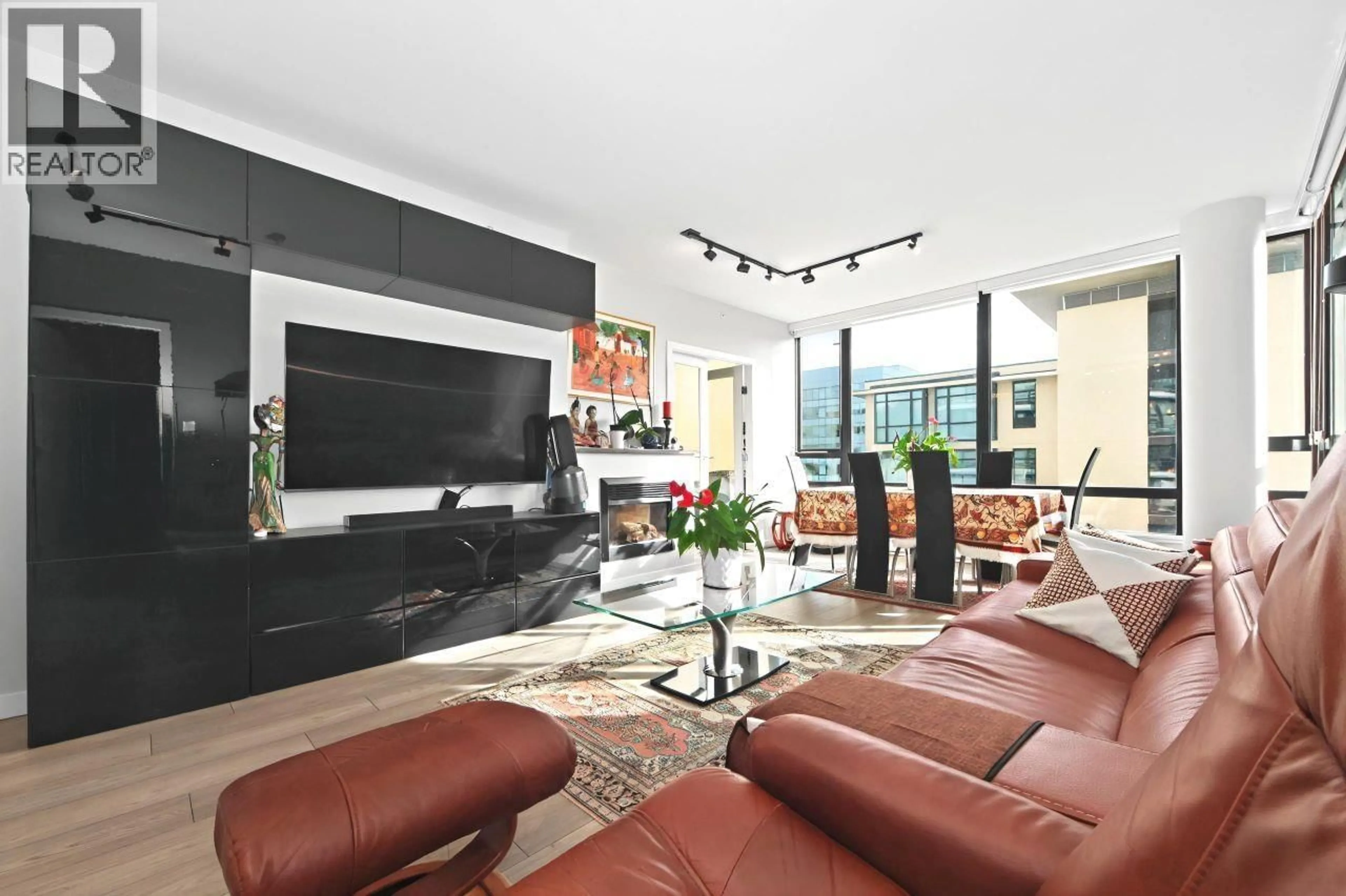 Living room with furniture, ceramic/tile floor for 703 - 110 BREW STREET, Port Moody British Columbia V3H0E4