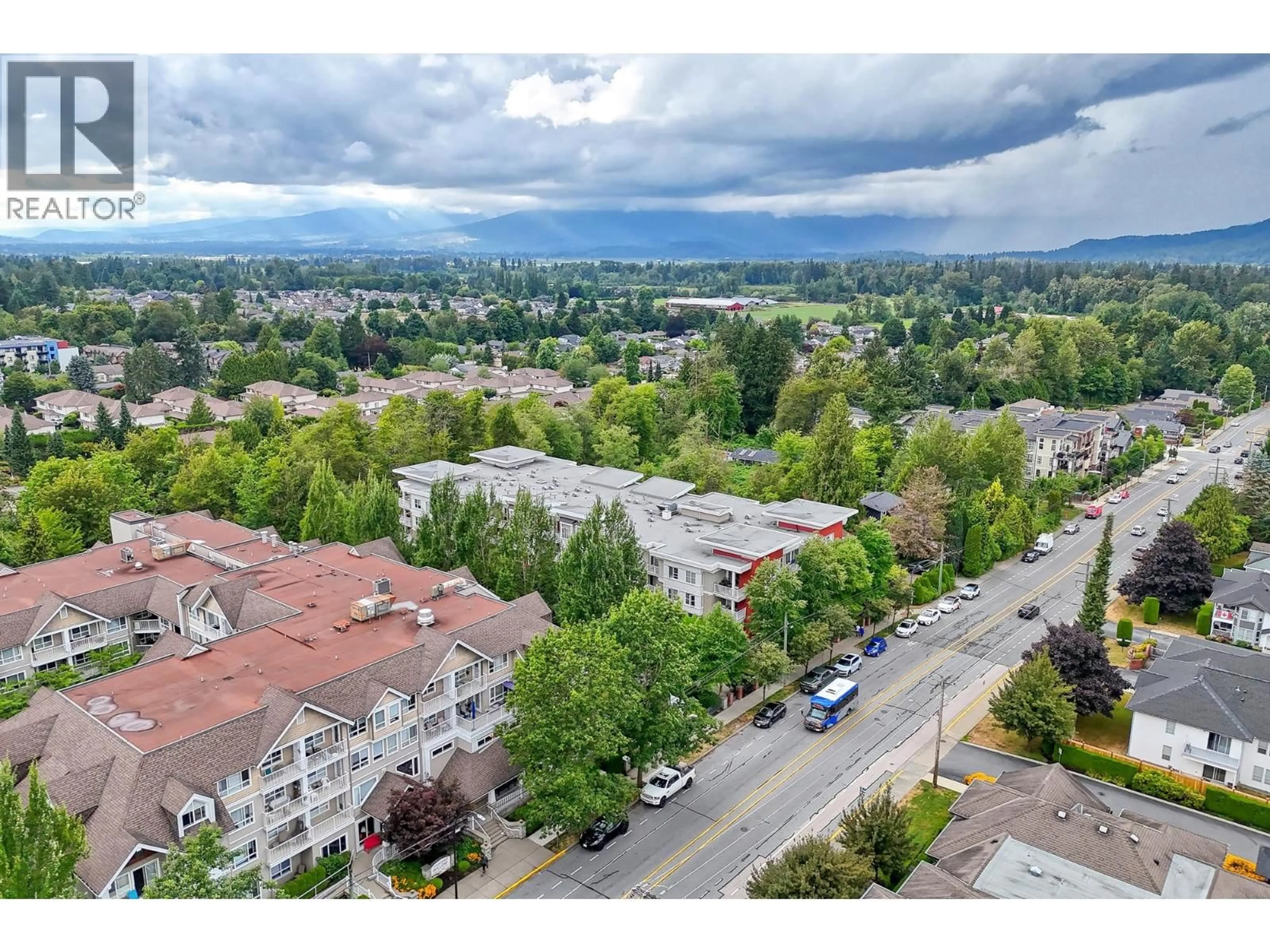 A pic from outside/outdoor area/front of a property/back of a property/a pic from drone, mountain view for 102 - 12283 224 STREET, Maple Ridge British Columbia V2X8Z3