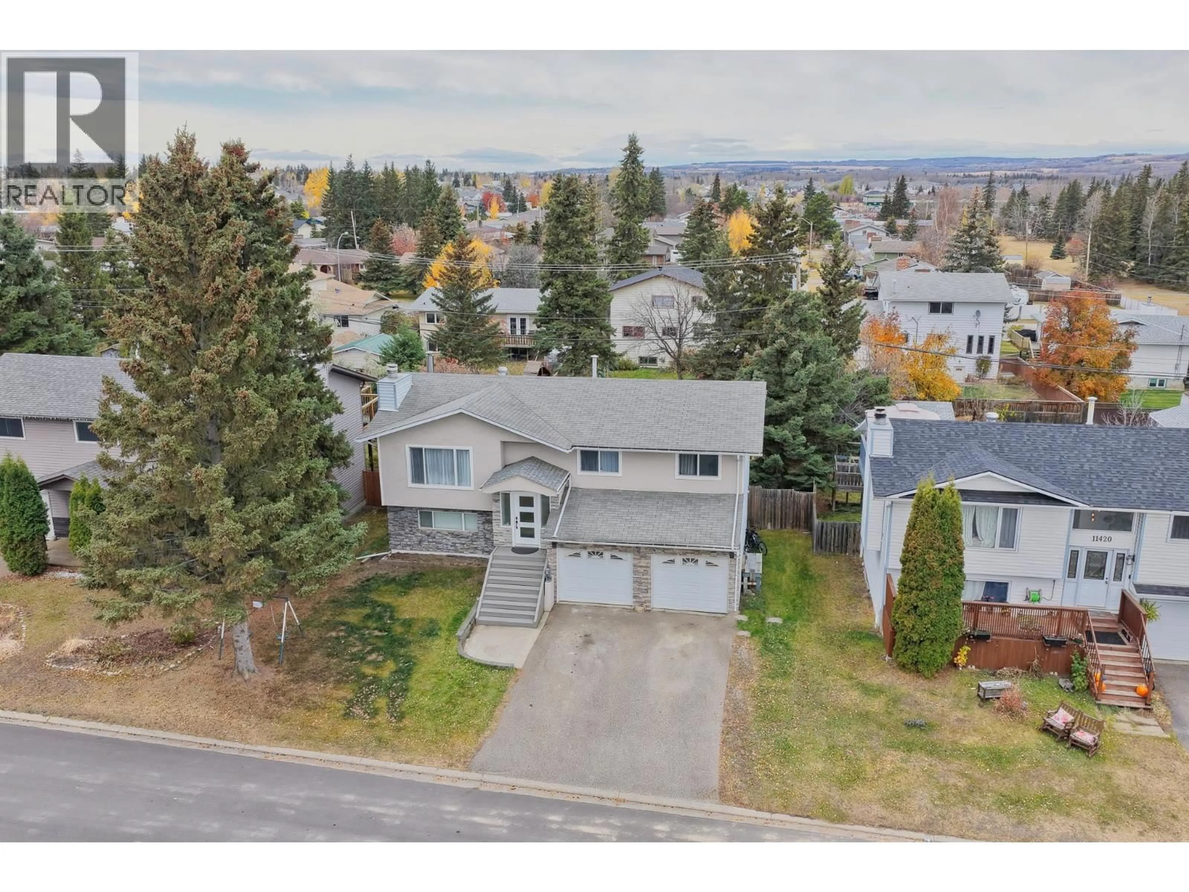 A pic from outside/outdoor area/front of a property/back of a property/a pic from drone, street for 11416 92 STREET, Fort St. John British Columbia V1J4Y3