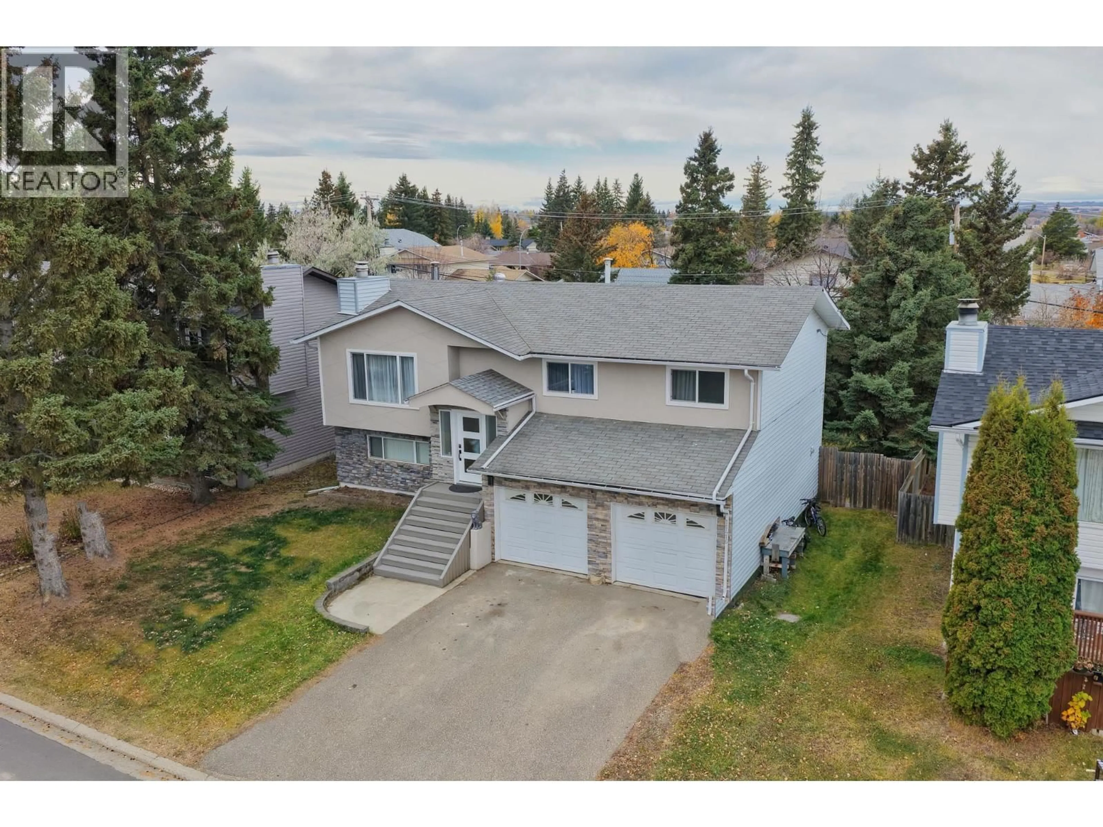A pic from outside/outdoor area/front of a property/back of a property/a pic from drone, street for 11416 92 STREET, Fort St. John British Columbia V1J4Y3