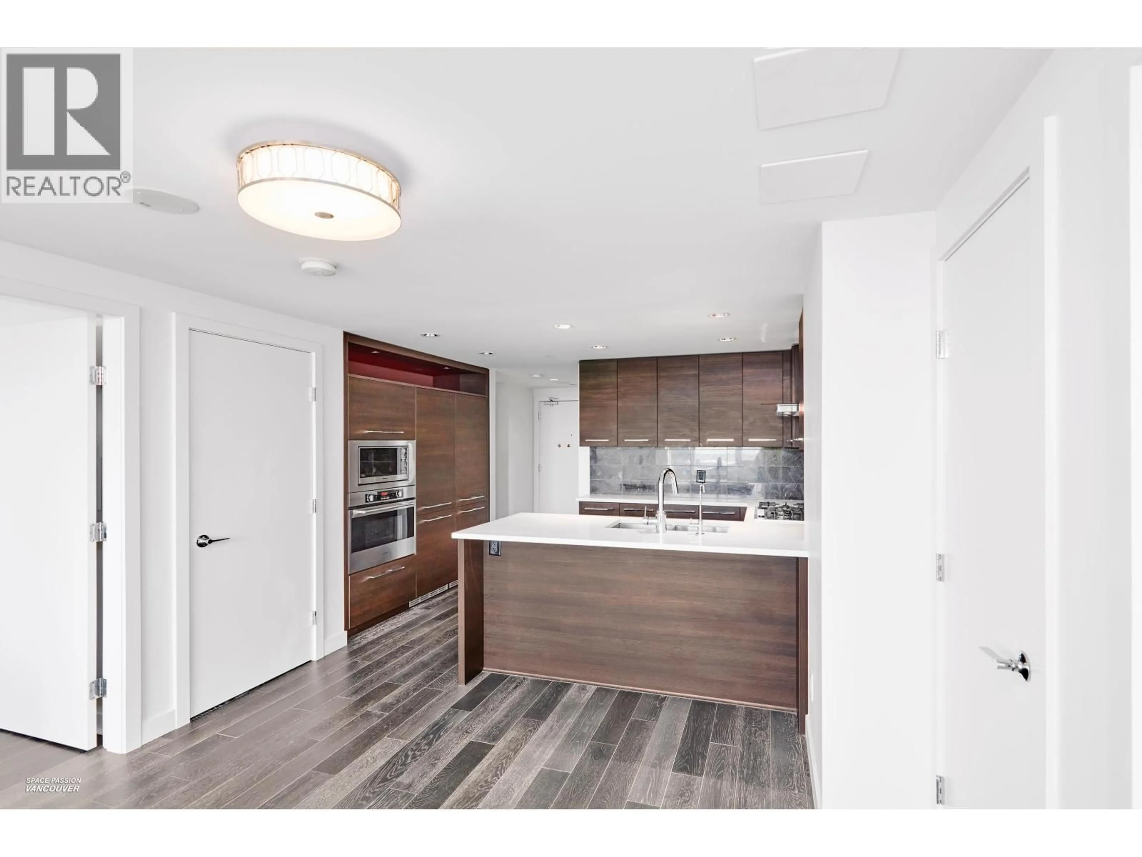 Open concept kitchen, wood/laminate floor for 1706 - 7488 LANSDOWNE ROAD, Richmond British Columbia V7C0B9