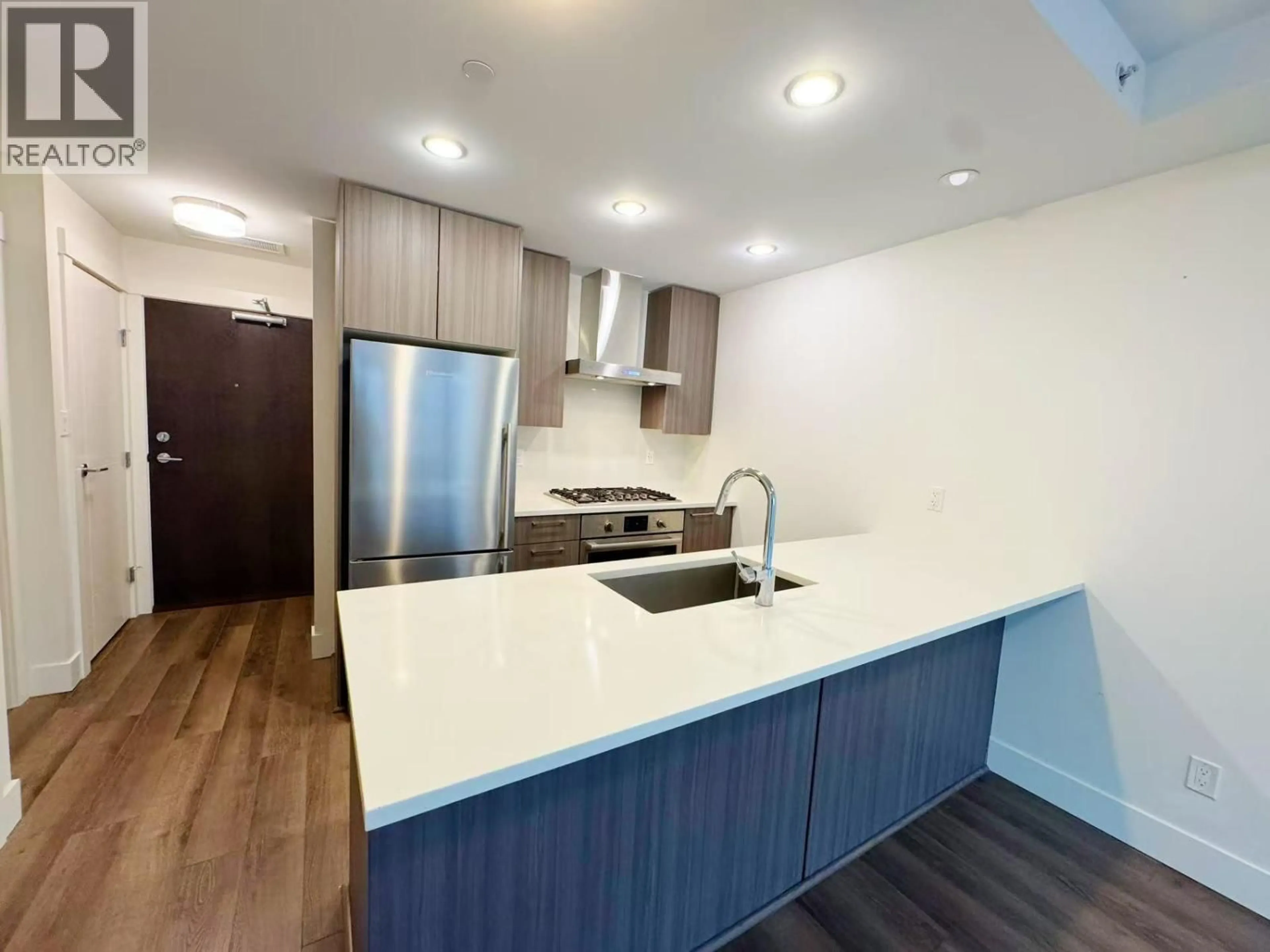 Open concept kitchen, wood/laminate floor for 318 - 10788 NO. 5 ROAD, Richmond British Columbia V6W0B7