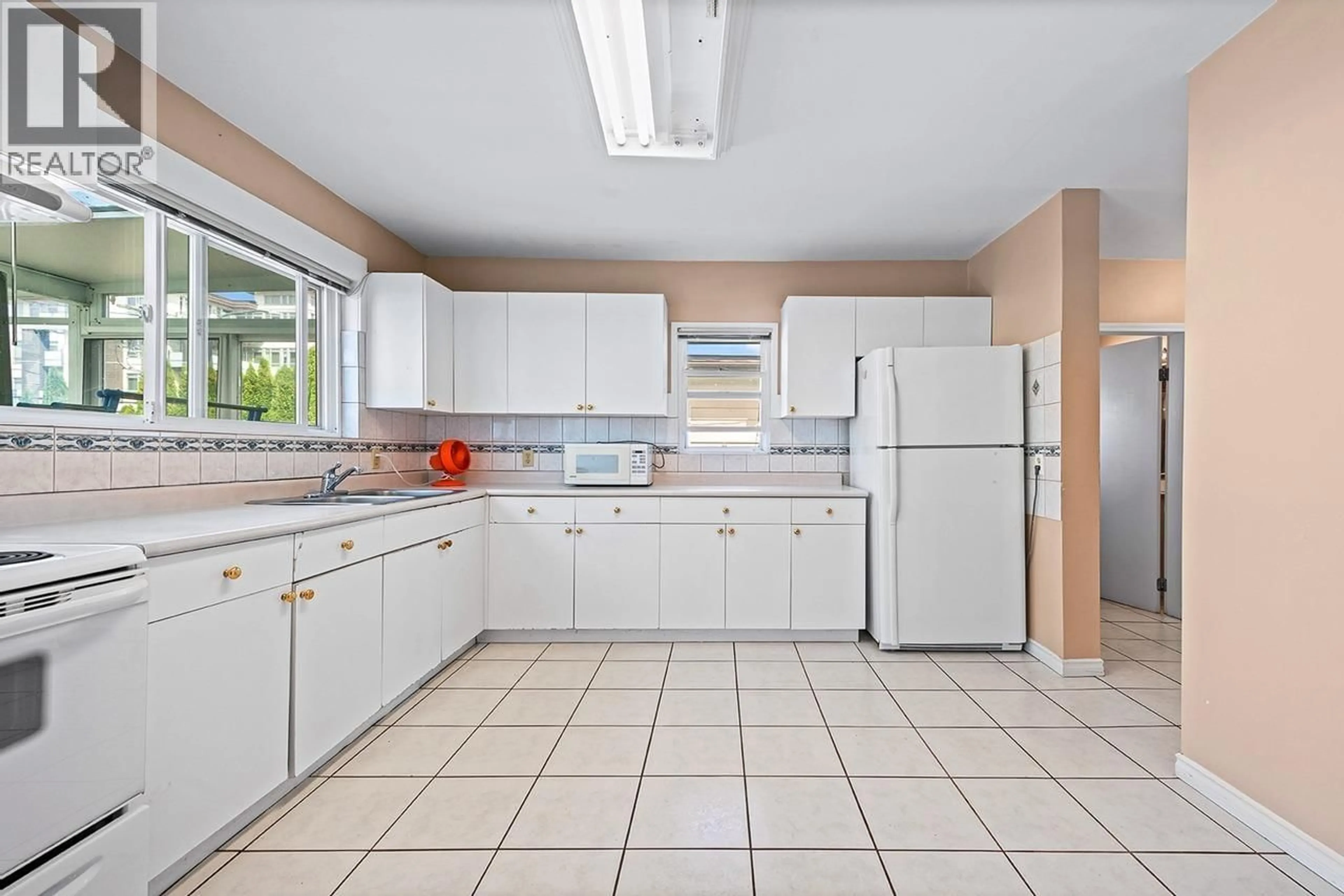 Standard kitchen, ceramic/tile floor for 4777 PENDER STREET, Burnaby British Columbia V5C2N4
