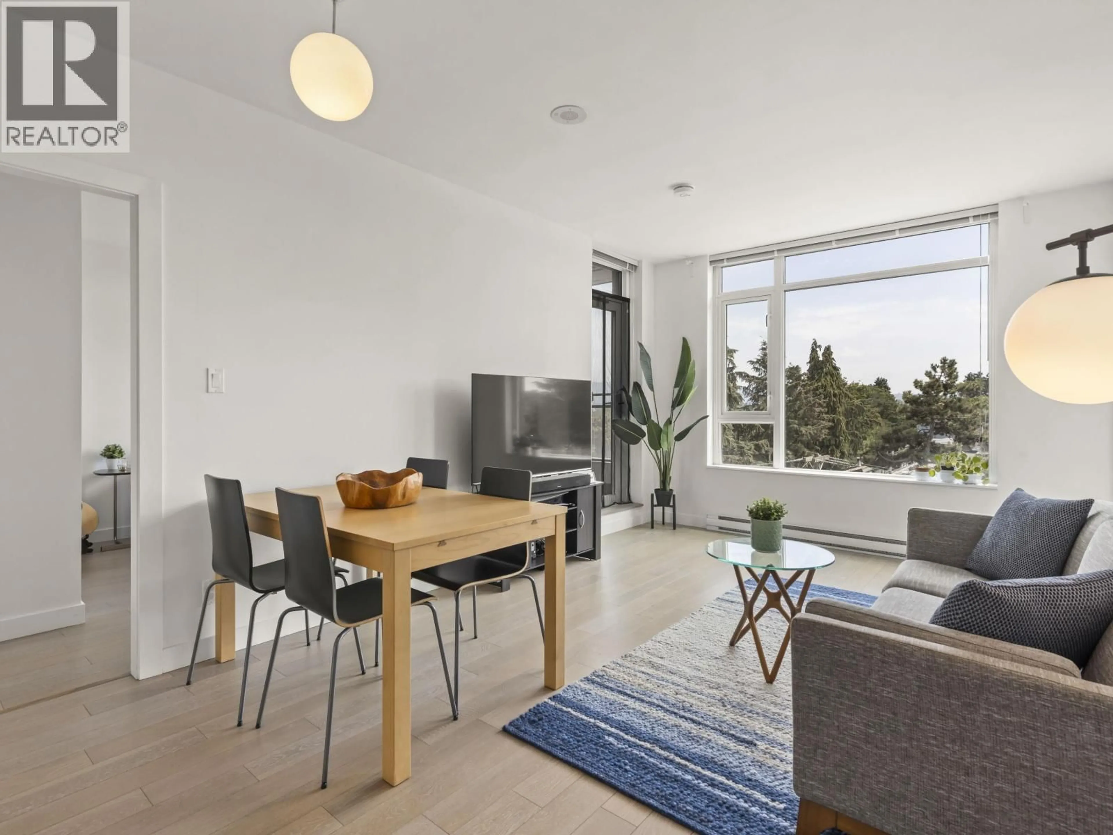 Living room with furniture, wood/laminate floor for 507 - 2321 SCOTIA STREET, Vancouver British Columbia V5T0A8