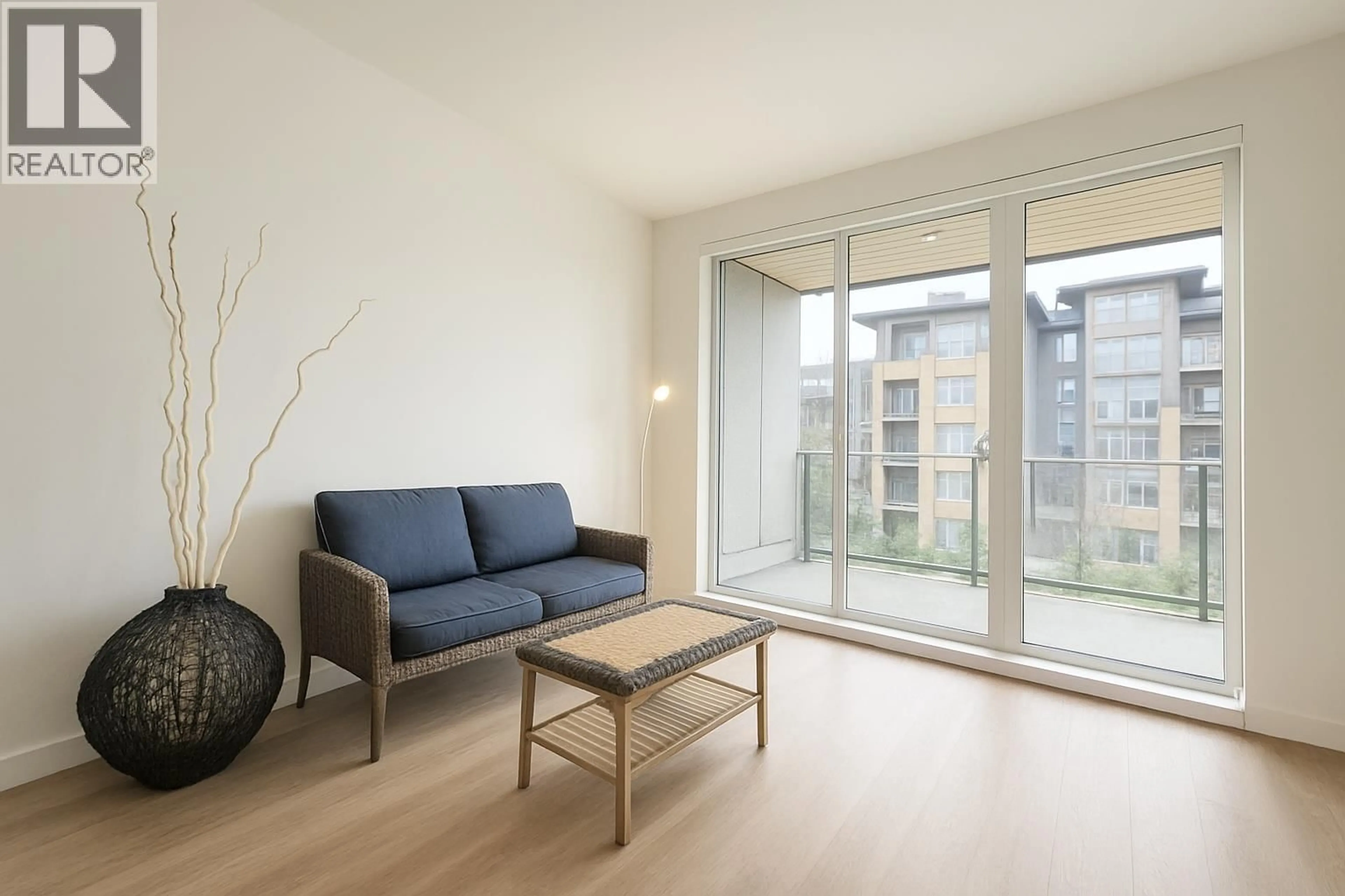 Living room with furniture, wood/laminate floor for 411 - 9888 UNIVERSITY CRESCENT, Burnaby British Columbia V5A0G4