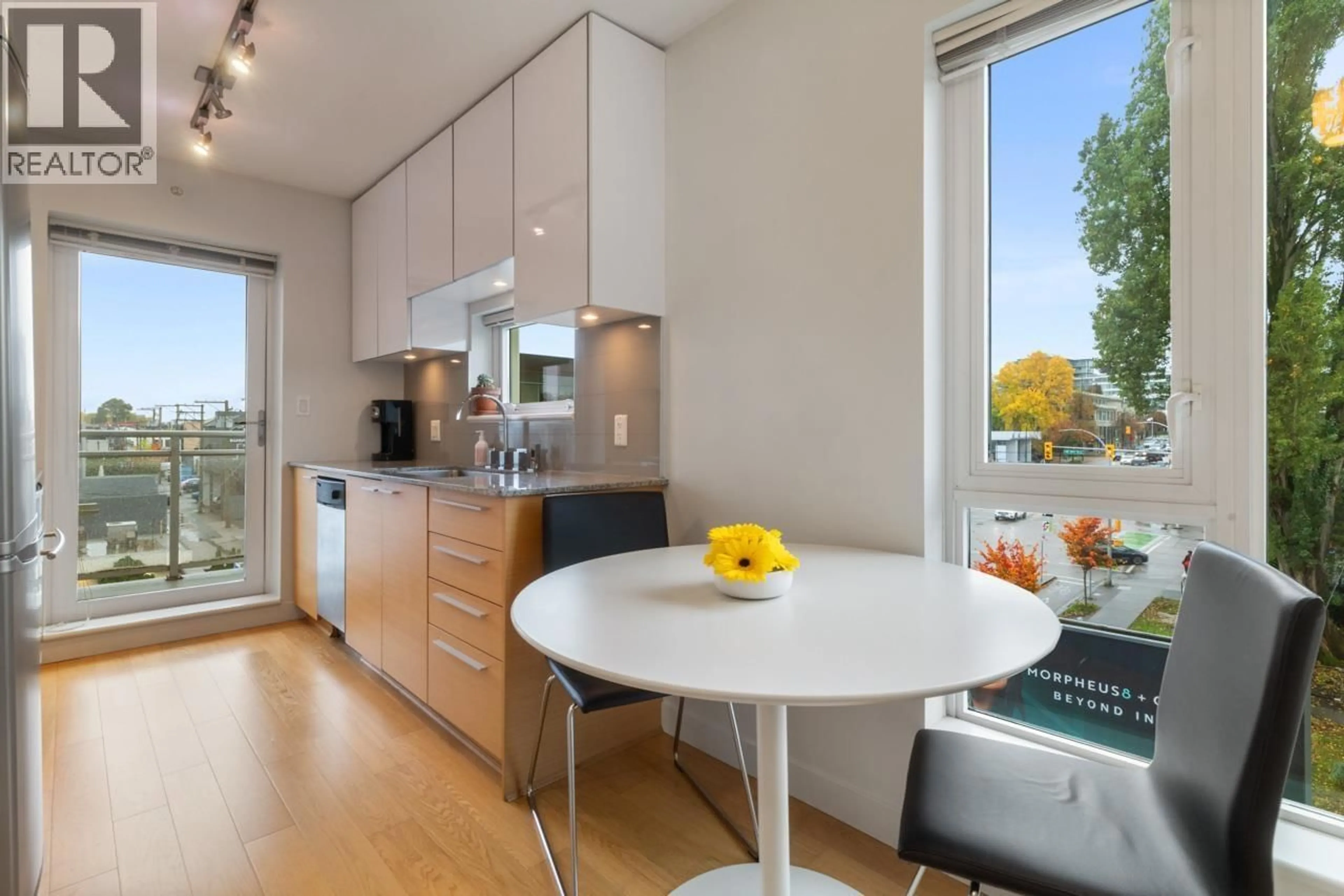 Open concept kitchen, wood/laminate floor for 507 - 1808 3RD AVENUE, Vancouver British Columbia V6J0C4
