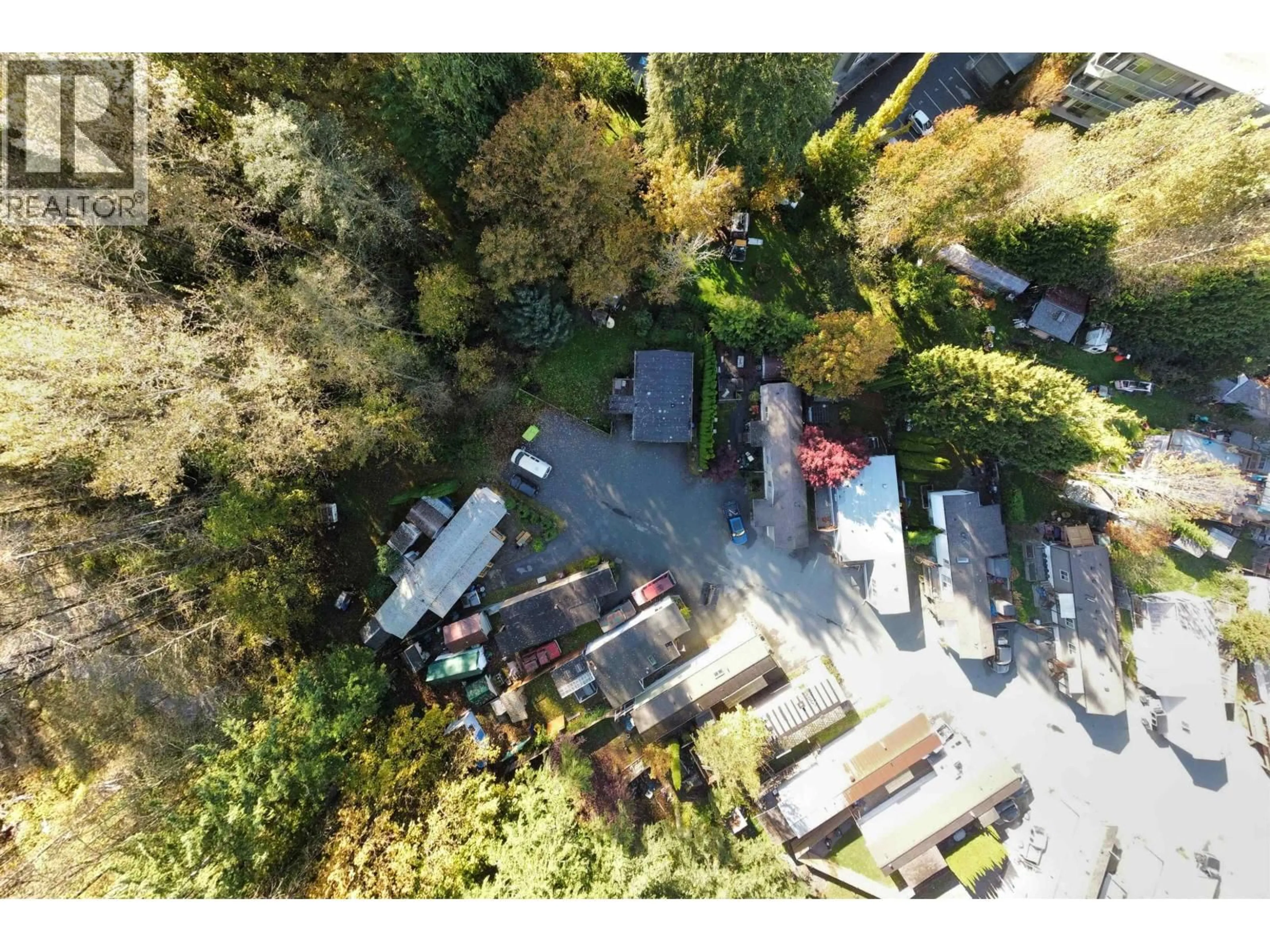 A pic from outside/outdoor area/front of a property/back of a property/a pic from drone, street for 8 - 39884 GOVERNMENT ROAD, Squamish British Columbia V8B0B1