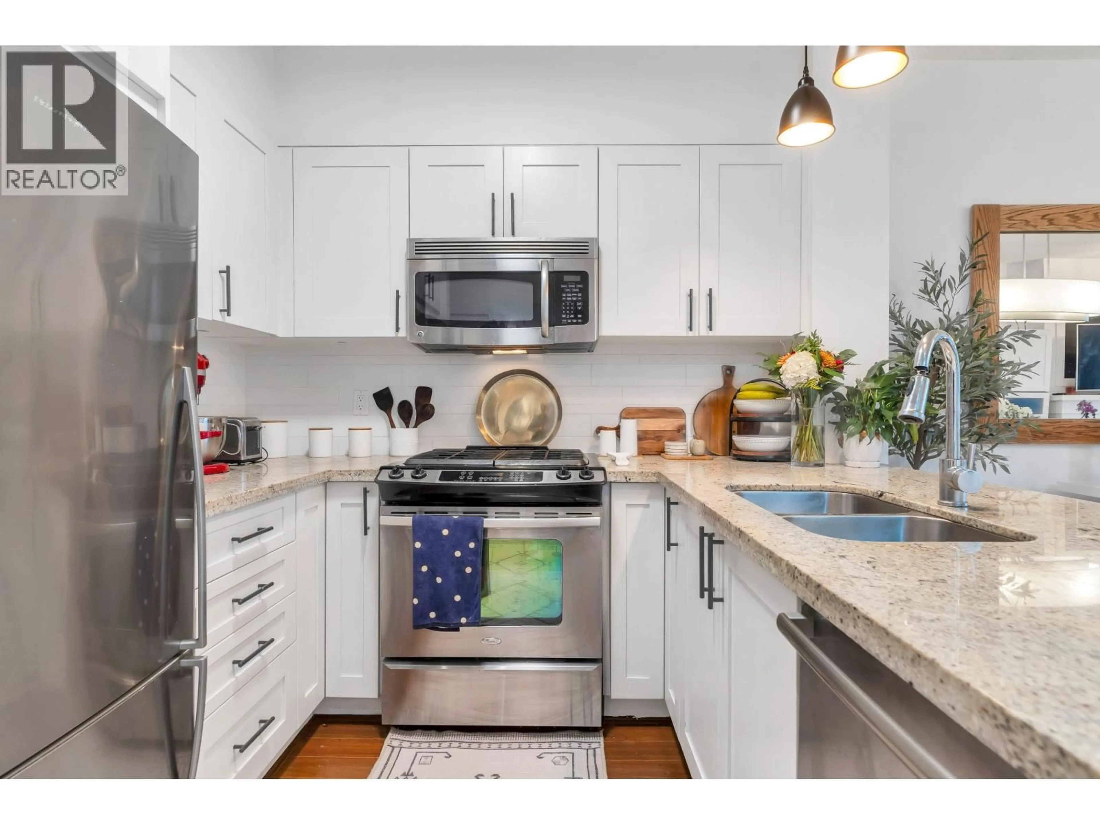 Open concept kitchen, unknown for 310 - 1111 27TH STREET, North Vancouver British Columbia V7J1S3