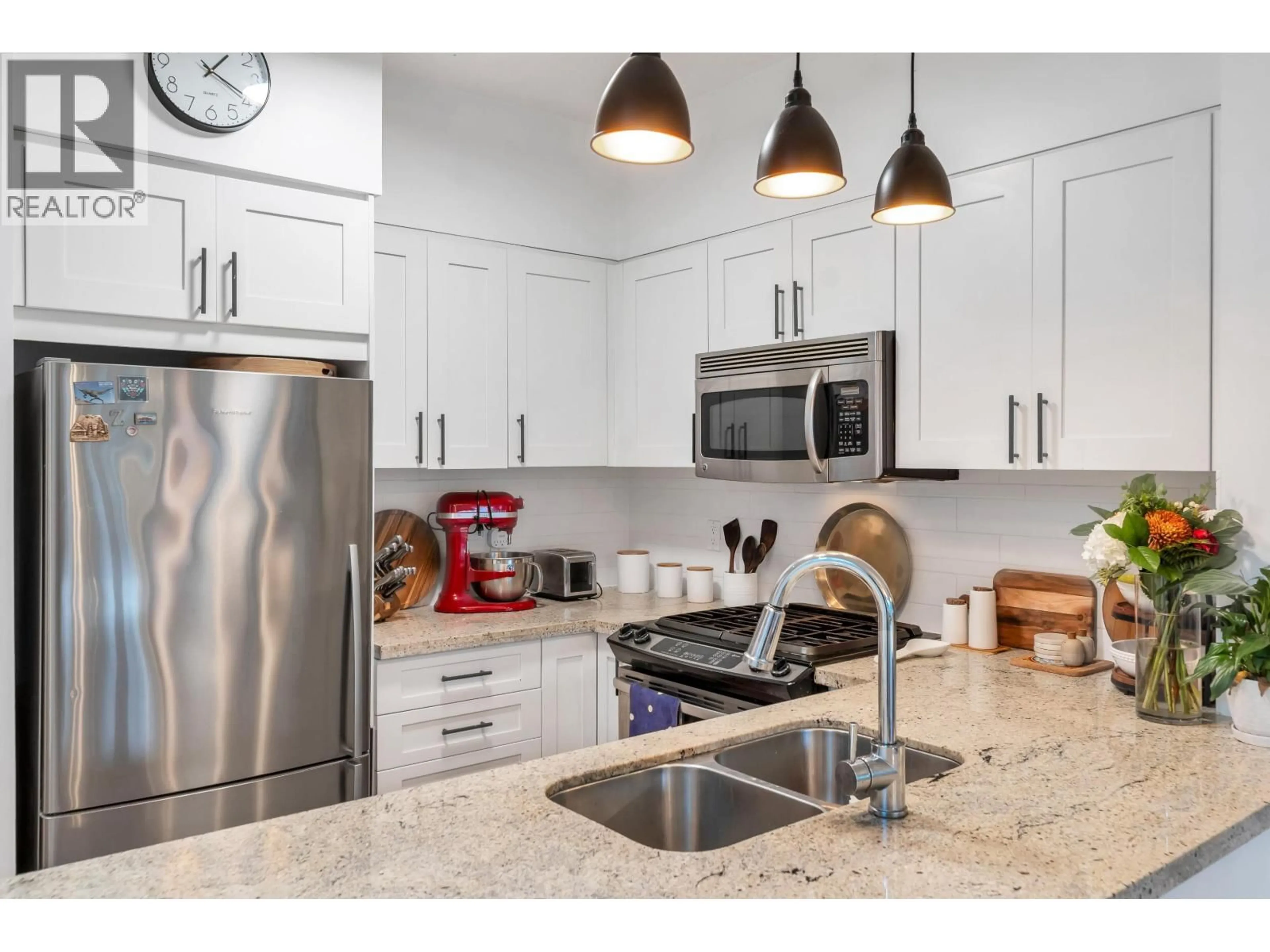 Open concept kitchen, ceramic/tile floor for 310 - 1111 27TH STREET, North Vancouver British Columbia V7J1S3