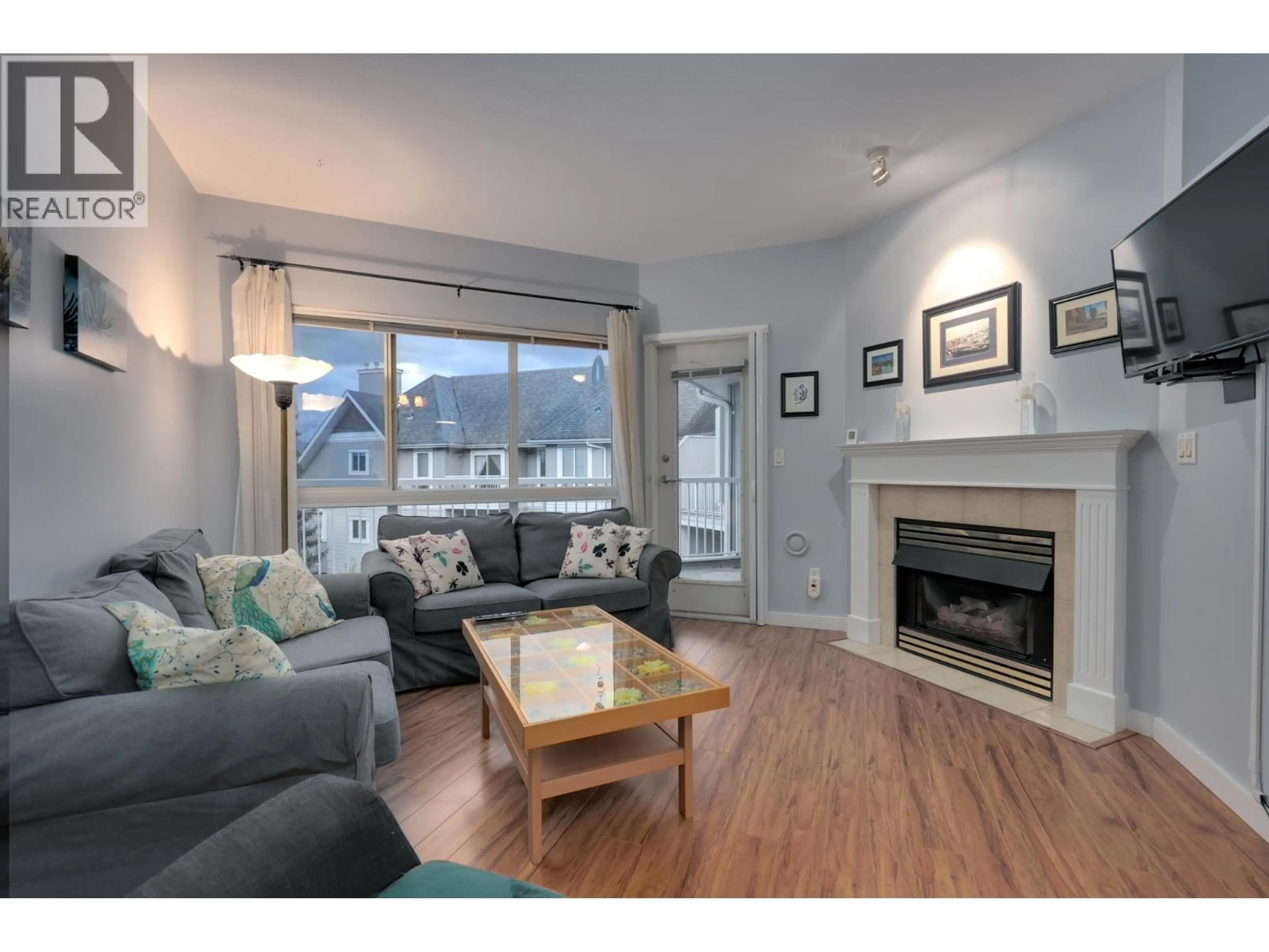 Living room with furniture, wood/laminate floor for 408 - 19091 MCMYN ROAD, Pitt Meadows British Columbia V3Y2S8