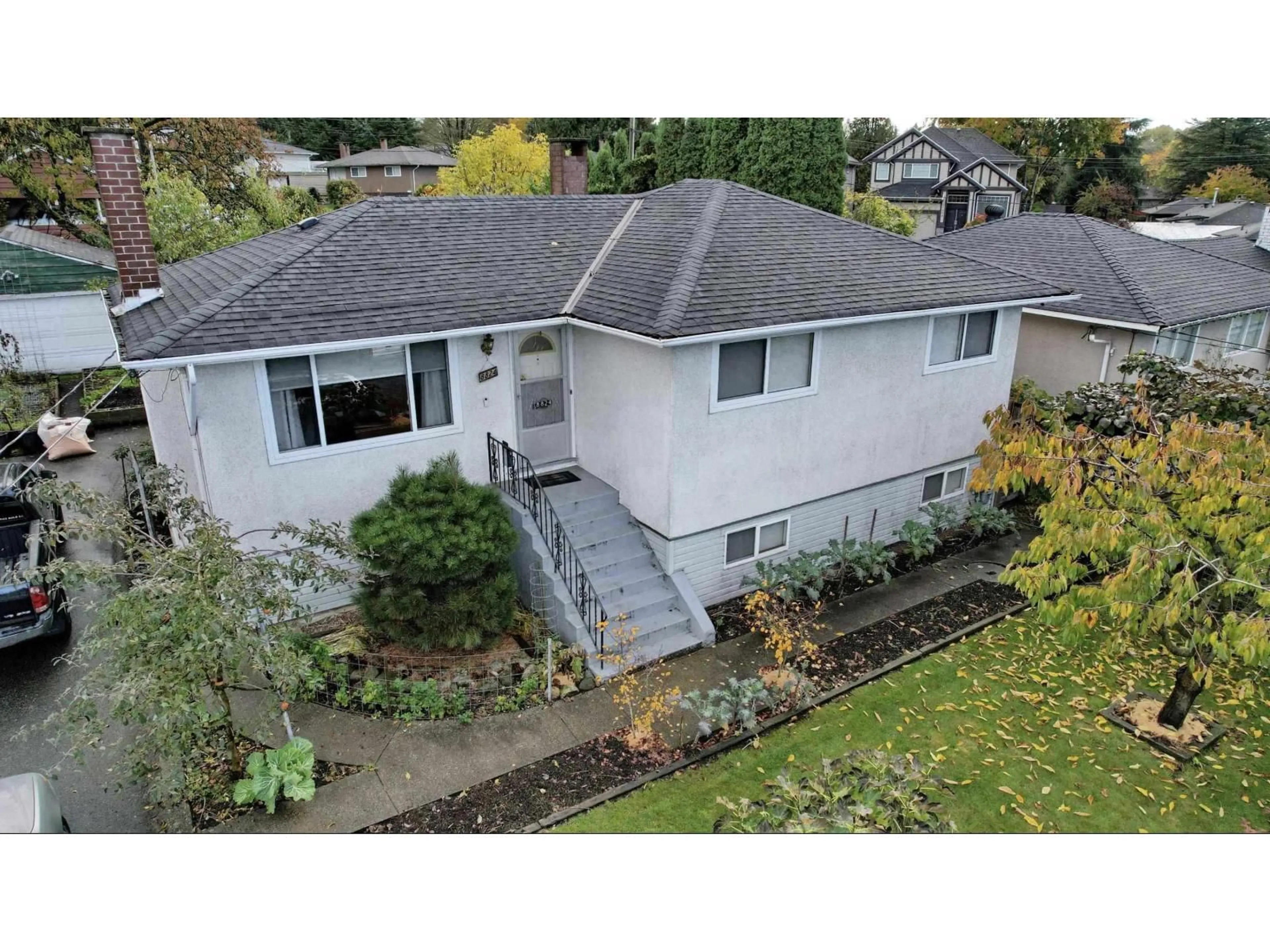A pic from outside/outdoor area/front of a property/back of a property/a pic from drone, street for 8824 RUSSELL, Delta British Columbia V4C4P7