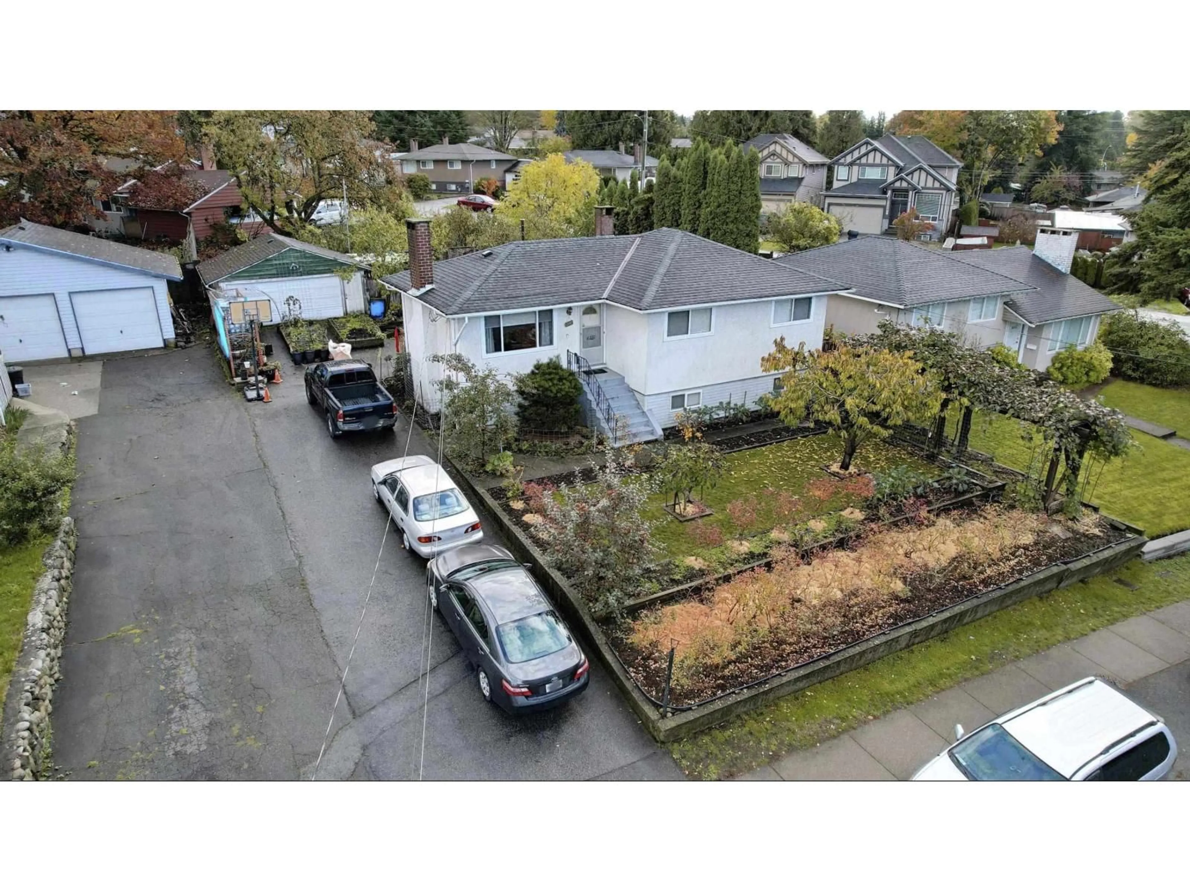 A pic from outside/outdoor area/front of a property/back of a property/a pic from drone, street for 8824 RUSSELL, Delta British Columbia V4C4P7