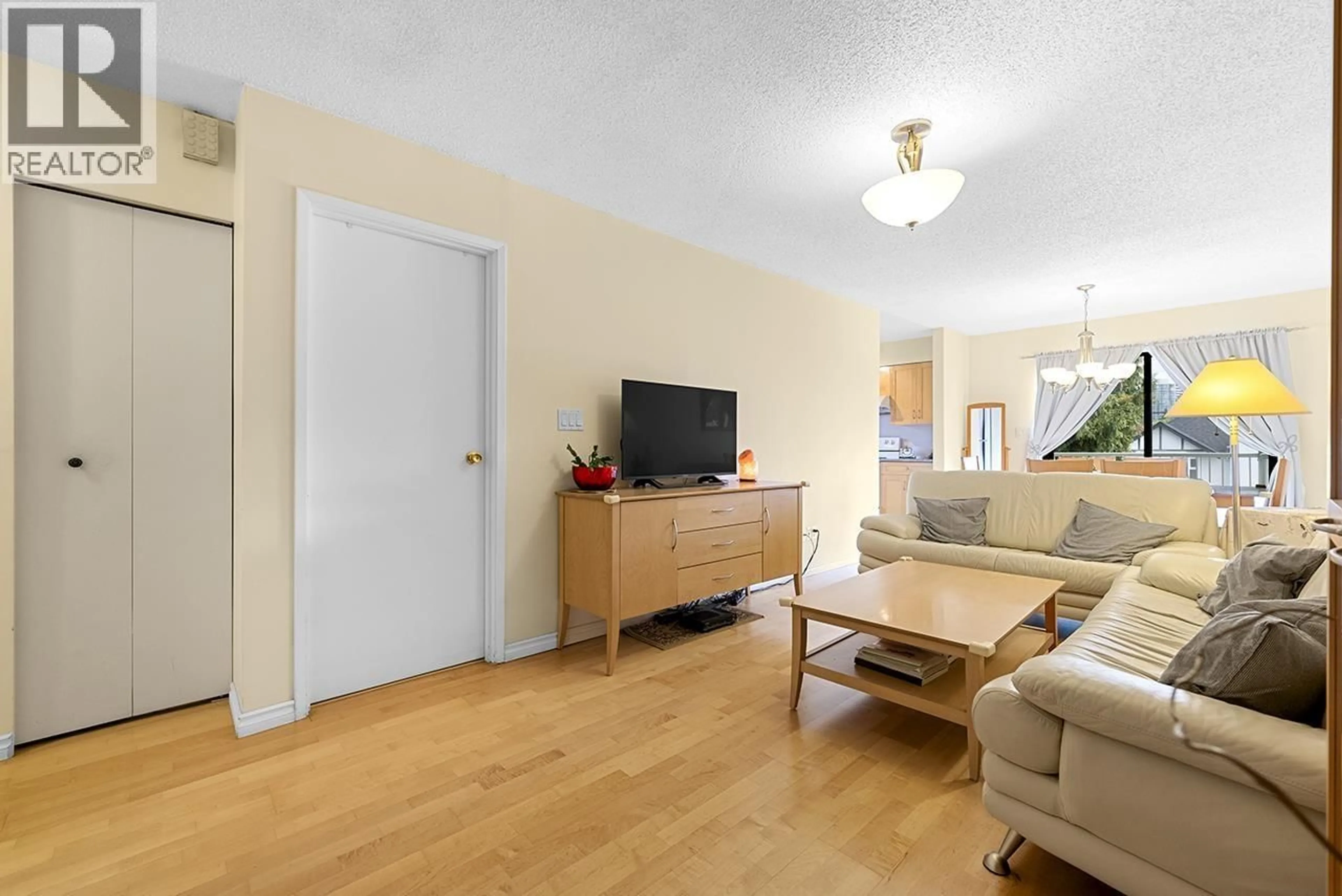 Living room with furniture, wood/laminate floor for 8416 - 8420 SHAUGHNESSY STREET, Vancouver British Columbia V6P3Y2