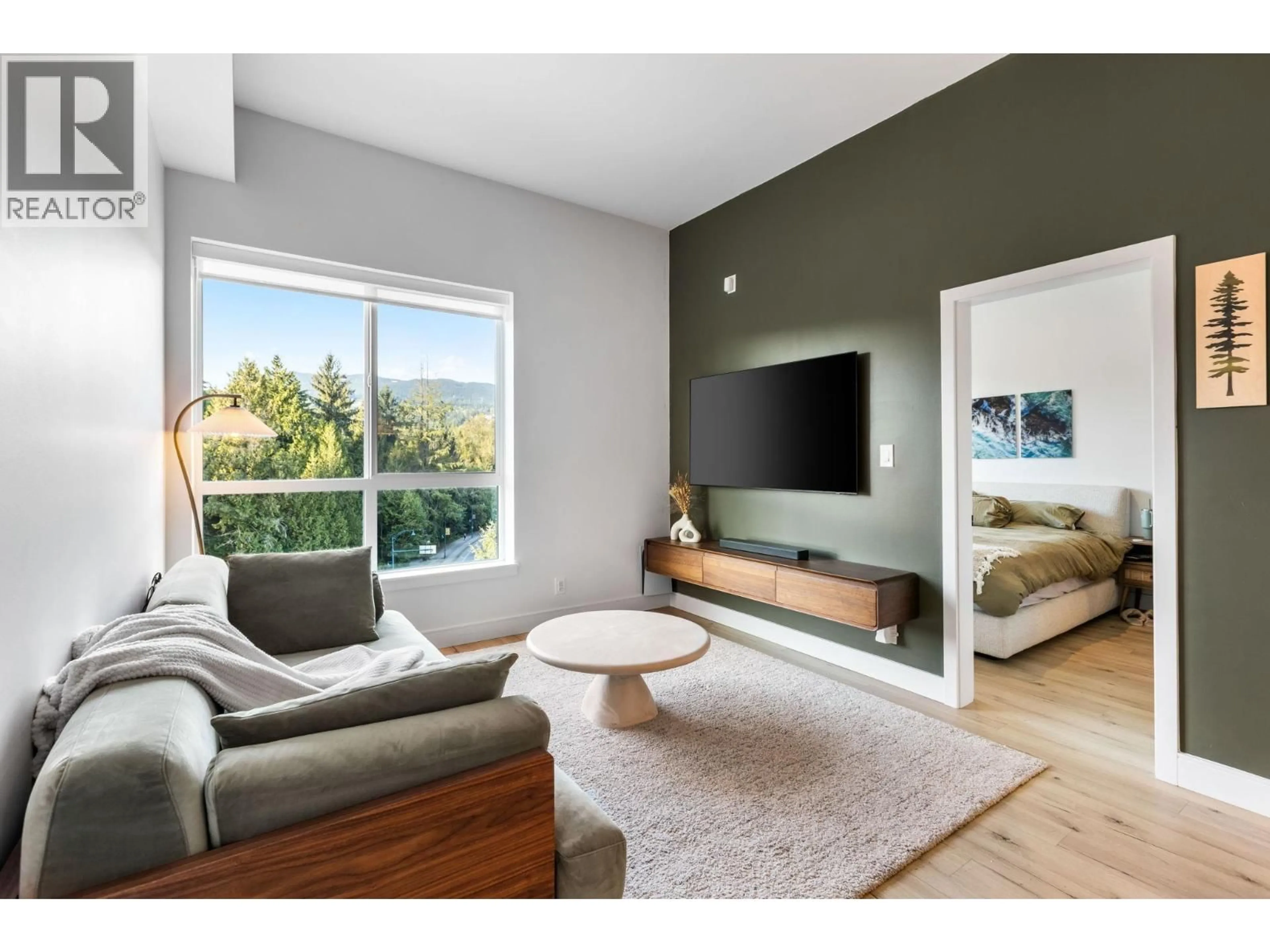Living room with furniture, wood/laminate floor for 619 - 55 KLAHANIE DRIVE, Port Moody British Columbia V3H0M9